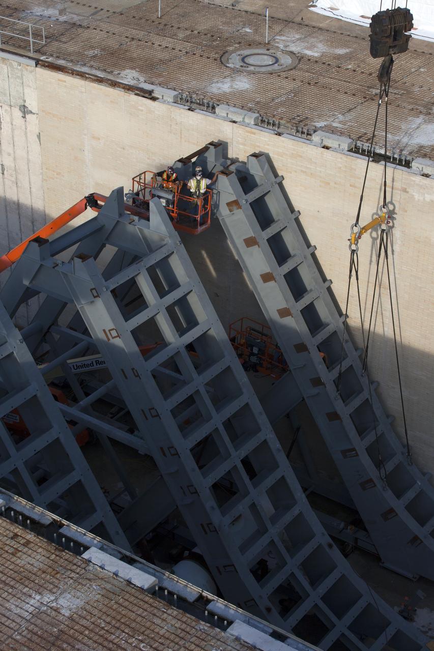 At Launch Pad 39B at NASA's Kennedy Space Center in Florida, construction workers prepare to weld together large segments of the support hardware for a new flame deflector in the flame trench. The new flame deflector will be positioned about six feet south of the shuttle-era flame deflector’s position. During liftoff of NASA’s Space Launch System, the rocket’s flame and energy will be diverted to the north side of the flame trench. The north side of the deflector will be protected by a NASA standard coating. The south side of the deflector will not be slanted and will have no lining. The new design will provide easier access for inspection, maintenance and repair. The Ground Systems Development and Operations (GSDO) Program at Kennedy is managing the installation of the flame deflector for Exploration Mission 1, deep space missions, and NASA's Journey to Mars. 