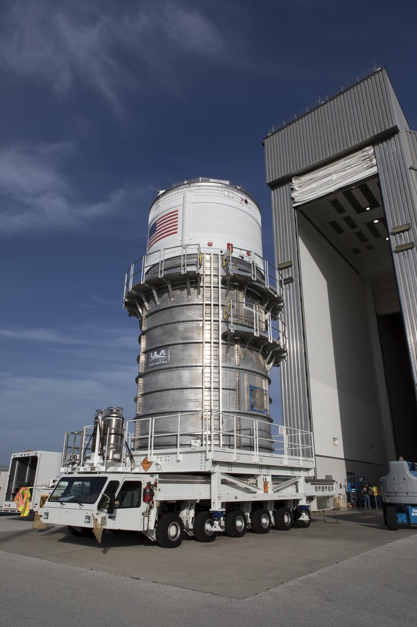The Interim Cryogenic Propulsion Stage (ICPS) for NASA's Space Launch System (SLS) rocket, packed inside a canister, exits the United Launch Alliance (ULA) Delta Operations Center near Space Launch Complex 37 at Cape Canaveral Air Force Station for its move to the Space Station Processing Facility at NASA's Kennedy Space Center in Florida. The ICPS is the first integrated piece of flight hardware to arrive for the SLS. It is the in-space stage that is located toward the top of the rocket, between the Launch Vehicle Stage Adapter and the Orion Spacecraft Adapter. It will provide some of the in-space propulsion during Orion's first flight test atop the SLS on Exploration Mission-1. 