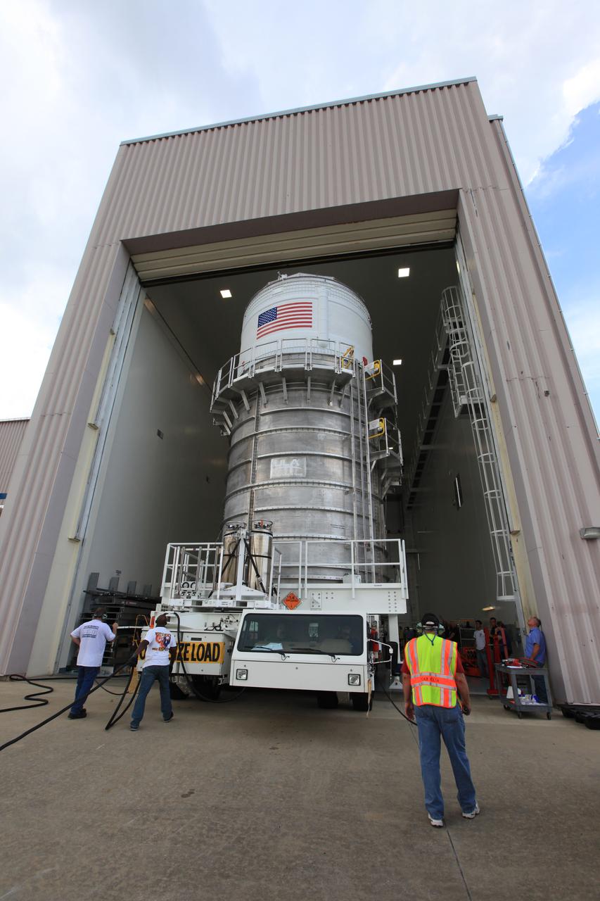 Packed inside its canister, the Interim Cryogenic Propulsion Stage (ICPS) for NASA's Space Launch System (SLS) rocket is moved into the low bay entrance of the Space Station Processing Facility at NASA's Kennedy Space Center in Florida. The ICPS is the first integrated piece of flight hardware to arrive for the SLS. It is the in-space stage that is located toward the top of the rocket, between the Launch Vehicle Stage Adapter and the Orion Spacecraft Adapter. It will provide some of the in-space propulsion during Orion's first flight test atop the SLS on Exploration Mission-1. 