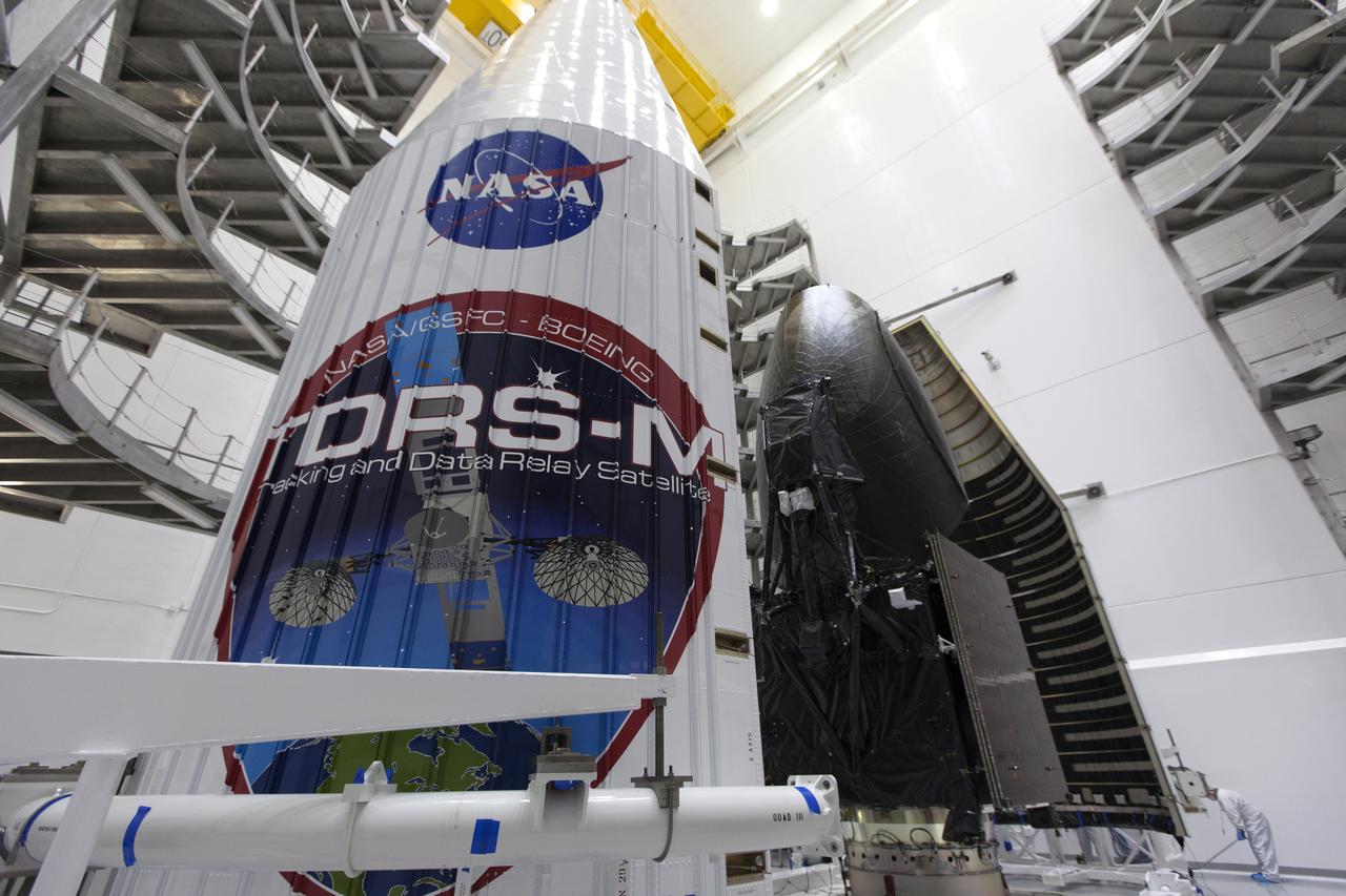 Inside the Astrotech facility in Titusville, Florida, the payload fairing for NASA's Tracking and Data Relay Satellite, TDRS-M, is moved into position to encapsulate the spacecraft. TDRS-M is the latest spacecraft destined for the agency's constellation of communications satellites that allows nearly continuous contact with orbiting spacecraft ranging from the International Space Station and Hubble Space Telescope to the array of scientific observatories. Liftoff atop a United Launch Alliance Atlas V rocket is scheduled to take place from Space Launch Complex 41 at Cape Canaveral Air Force Station at 8:03 a.m. EDT Aug. 18, 2017.