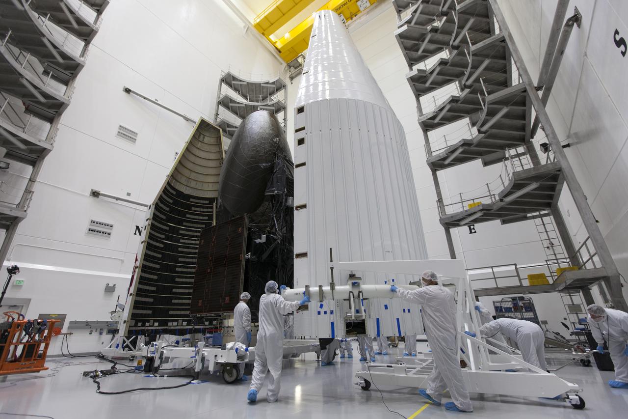Inside the Astrotech facility in Titusville, Florida, the payload fairing for NASA's Tracking and Data Relay Satellite, TDRS-M, is moved into position to encapsulate the spacecraft. TDRS-M is the latest spacecraft destined for the agency's constellation of communications satellites that allows nearly continuous contact with orbiting spacecraft ranging from the International Space Station and Hubble Space Telescope to the array of scientific observatories. Liftoff atop a United Launch Alliance Atlas V rocket is scheduled to take place from Space Launch Complex 41 at Cape Canaveral Air Force Station at 8:03 a.m. EDT Aug. 18, 2017.