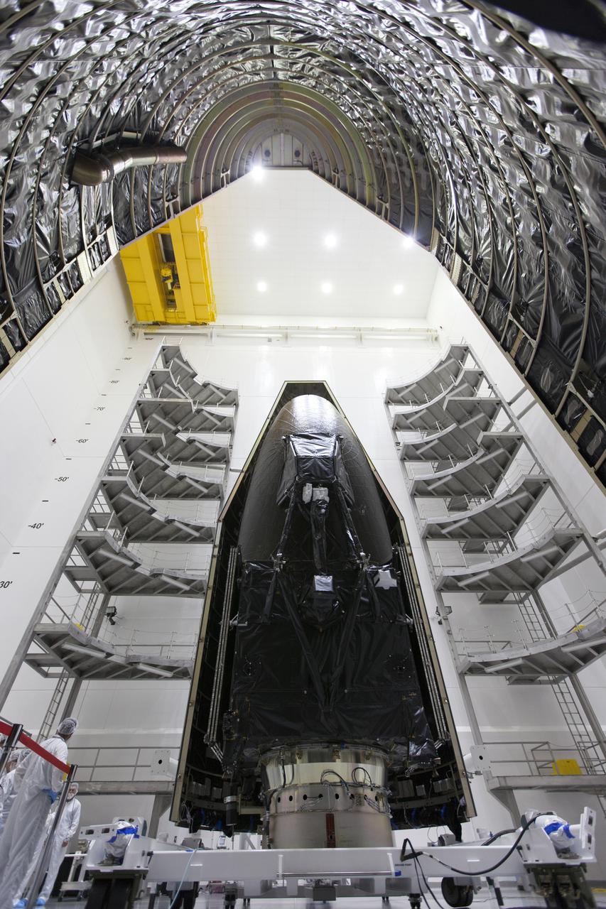 Inside the Astrotech facility in Titusville, Florida, the payload fairing for NASA's Tracking and Data Relay Satellite, TDRS-M, is positioned to encapsulate the spacecraft. TDRS-M is the latest spacecraft destined for the agency's constellation of communications satellites that allows nearly continuous contact with orbiting spacecraft ranging from the International Space Station and Hubble Space Telescope to the array of scientific observatories. Liftoff atop a United Launch Alliance Atlas V rocket is scheduled to take place from Space Launch Complex 41 at Cape Canaveral Air Force Station at 8:03 a.m. EDT Aug. 18, 2017.