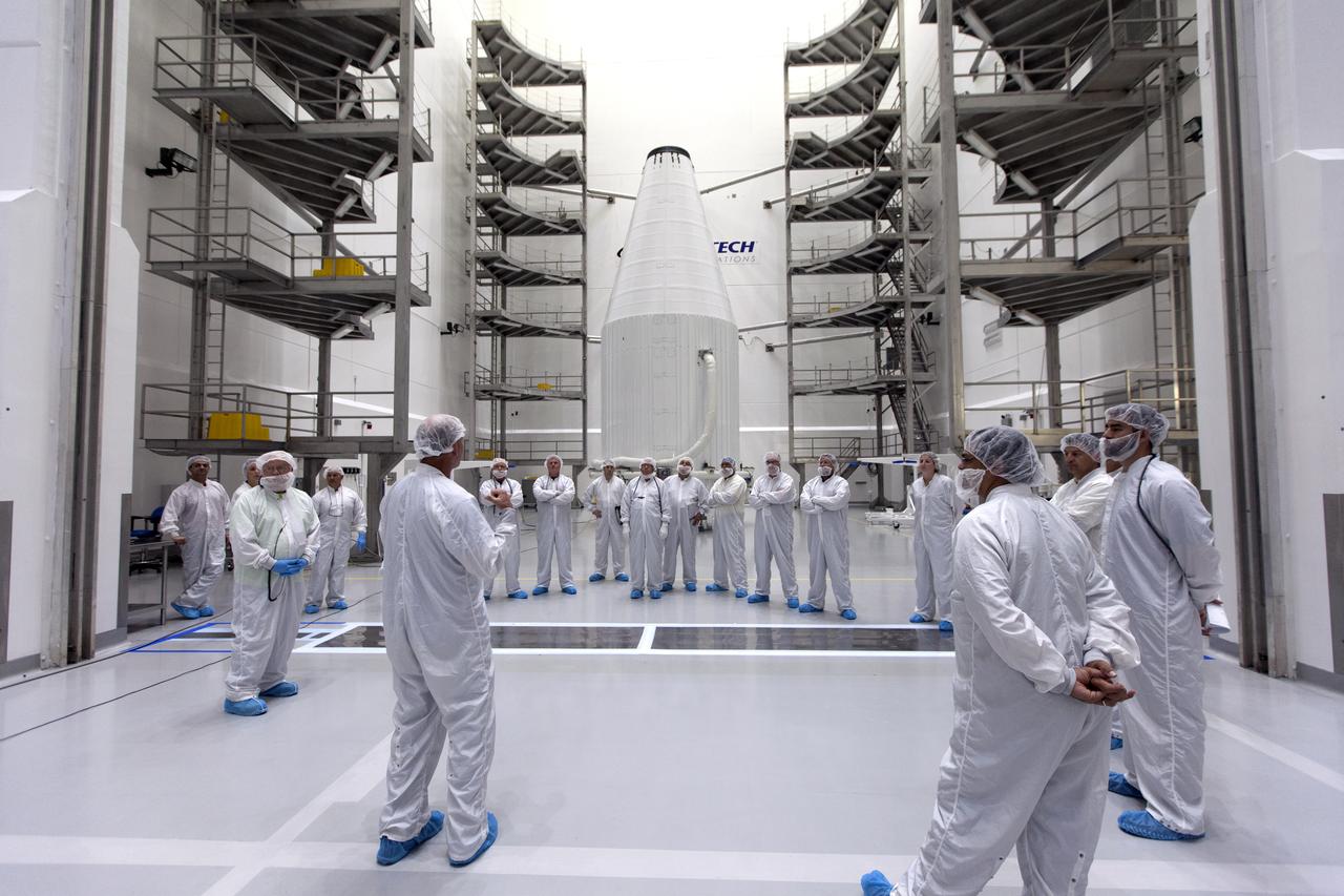 Inside the Astrotech facility near NASA's Kennedy Space Center in Florida, the agency's TDRS-M satellite, enclosed in its payload fairing, is being prepared for lifting to a transport vehicle. Engineers and technicians in clean room attire review procedures before the lifting process begins. The TDRS-M is the latest spacecraft destined for the agency's constellation of communications satellites that allows nearly continuous contact with orbiting spacecraft ranging from the International Space Station and Hubble Space Telescope to the array of scientific observatories. Liftoff atop a United Launch Alliance Atlas V rocket is scheduled to take place from Space Launch Complex 41 at Cape Canaveral Air Force Station on Aug. 18 at 8:03 a.m. EDT. 