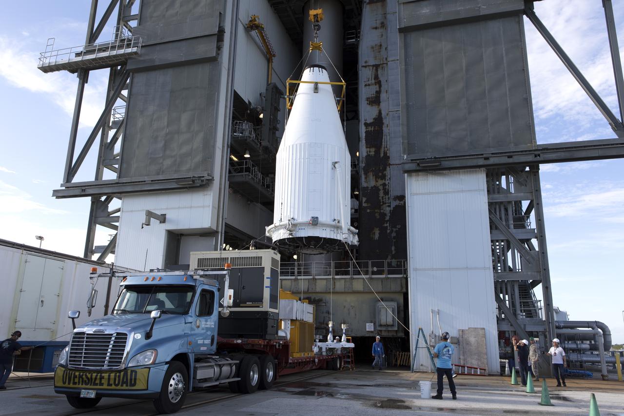 A crane is used to lift the payload fairing containing NASA's Tracking and Data Relay Satellite (TDRS-M) at the Vertical Integration Facility at Space Launch Complex 41 at Cape Canaveral Air Force Station in Florida. TDRS-M will be stacked atop the United Launch Alliance Atlas V Centaur upper stage. TDRS-M will be the latest spacecraft destined for the agency's constellation of communications satellites that allows nearly continuous contact with orbiting spacecraft ranging from the International Space Station and Hubble Space Telescope to the array of scientific observatories. Liftoff atop the ULA Atlas V rocket is scheduled for Aug. 18, 2017.