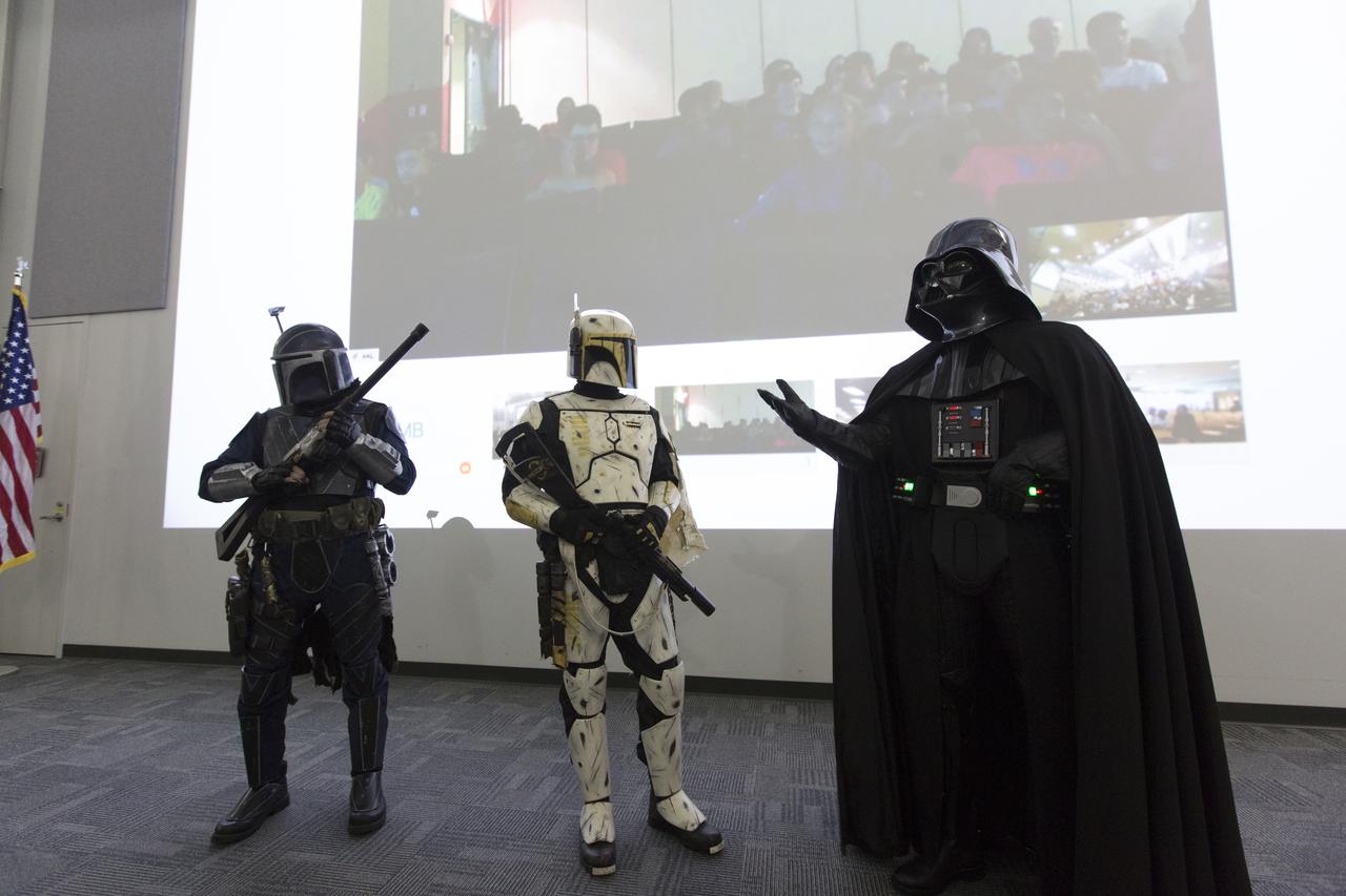 Darth Vader and other Star Wars characters from the 501st Legion address students and sponsors in the Center for Space Education at NASA’s Kennedy Space Center in Florida. Teams from across the state of Florida were gathered at Kennedy for the finals of the Zero Robotics Middle School Summer Program national championship. The five-week program allows rising sixth- through ninth-graders to write programs for small satellites called SPHERES (Synchronized, Position, Hold, Engage, Reorient, Experimental Satellites). Finalists saw their code tested aboard the International Space Station.
