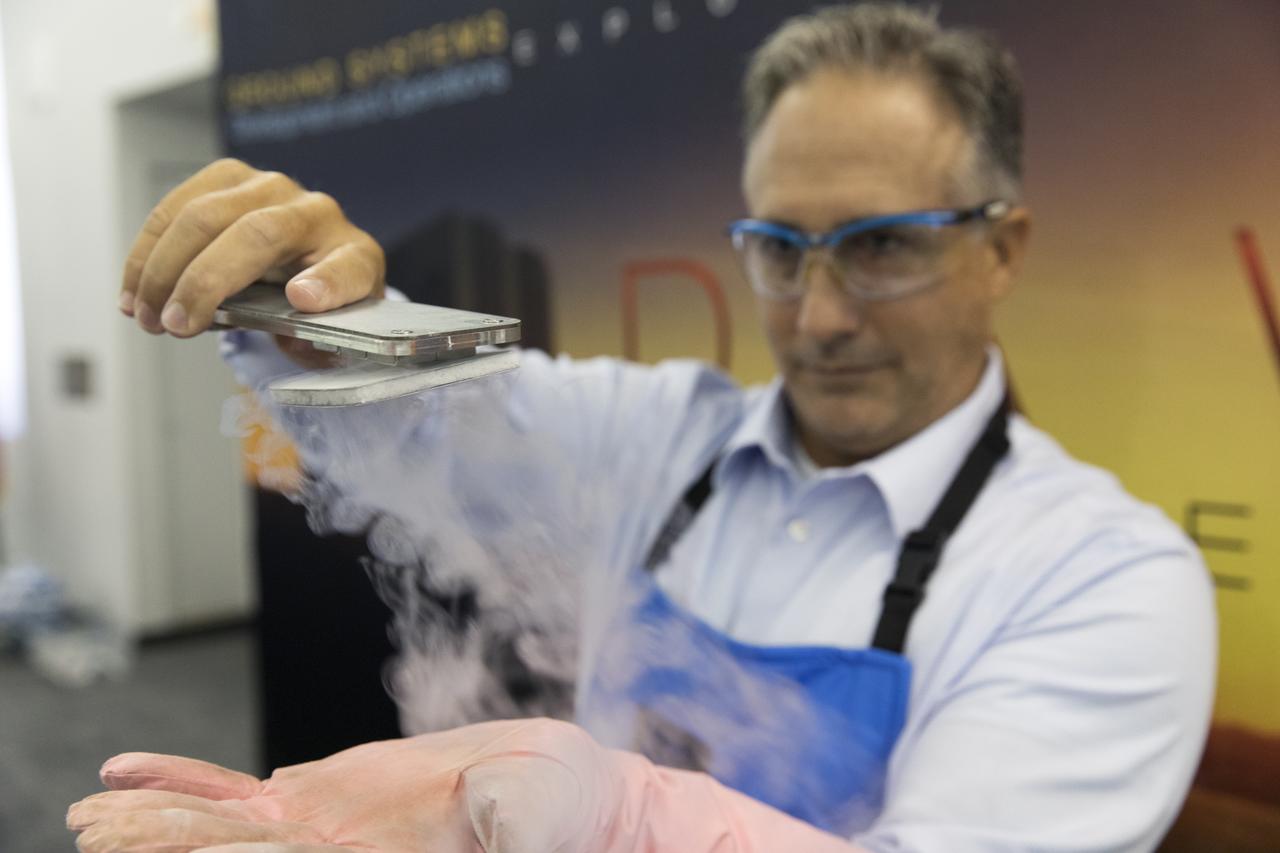 NASA Kennedy Space Center's Trent Smith conducts a quantum levitation demonstration, using liquid nitrogen, metal and a magnetic track, for students and their sponsors in the Center for Space Education at NASA’s Kennedy Space Center in Florida. Teams from across the state of Florida were gathered at Kennedy for the finals of the Zero Robotics Middle School Summer Program national championship. The five-week program allows rising sixth- through ninth-graders to write programs for small satellites called SPHERES (Synchronized, Position, Hold, Engage, Reorient, Experimental Satellites). Finalists saw their code tested aboard the International Space Station.