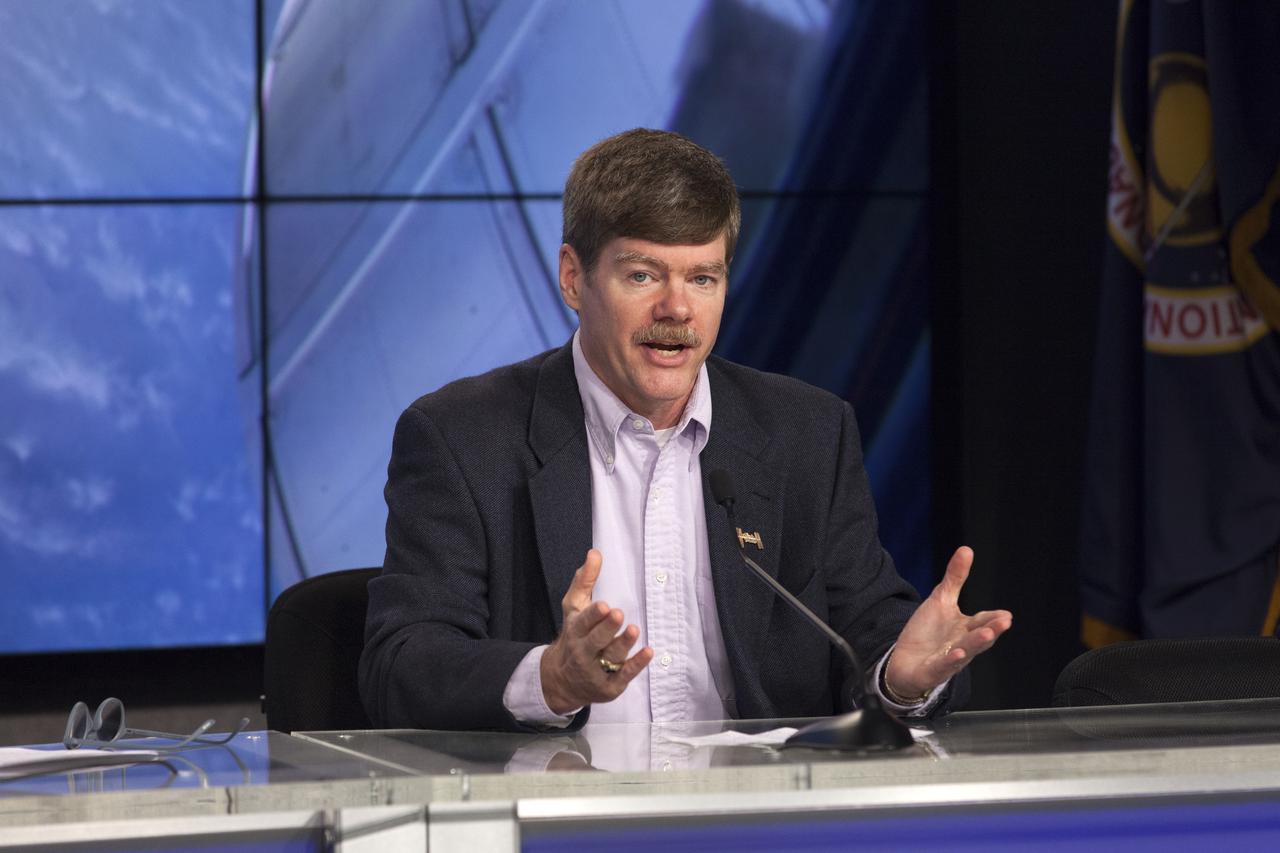 In the Kennedy Space Center’s Press Site auditorium, Pete Hasbrook, associate program scientist for the International Space Station Program, speaks to members of the media during a prelaunch news conference for the SpaceX CRS-12 commercial resupply services mission to the International Space Station. A Dragon spacecraft is scheduled to be launched from Kennedy’s Launch Complex 39A on Aug. 14 atop a SpaceX Falcon 9 rocket on the company's 12th Commercial Resupply Services mission to the space station.