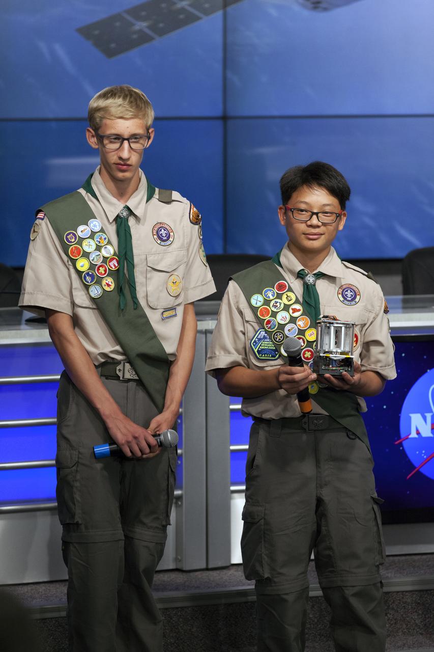 Boy Scouts of America Troop 209 members Andrew Frank, left, and Elliot Lee speak to members of social media in the Kennedy Space Center’s Press Site auditorium. The briefing focused on research planned for launch to the International Space Station. The scientific materials and supplies will be aboard a Dragon spacecraft scheduled for launch from Kennedy’s Launch Complex 39A on Aug. 14 atop a SpaceX Falcon 9 rocket on the company's 12th Commercial Resupply Services mission to the space station.