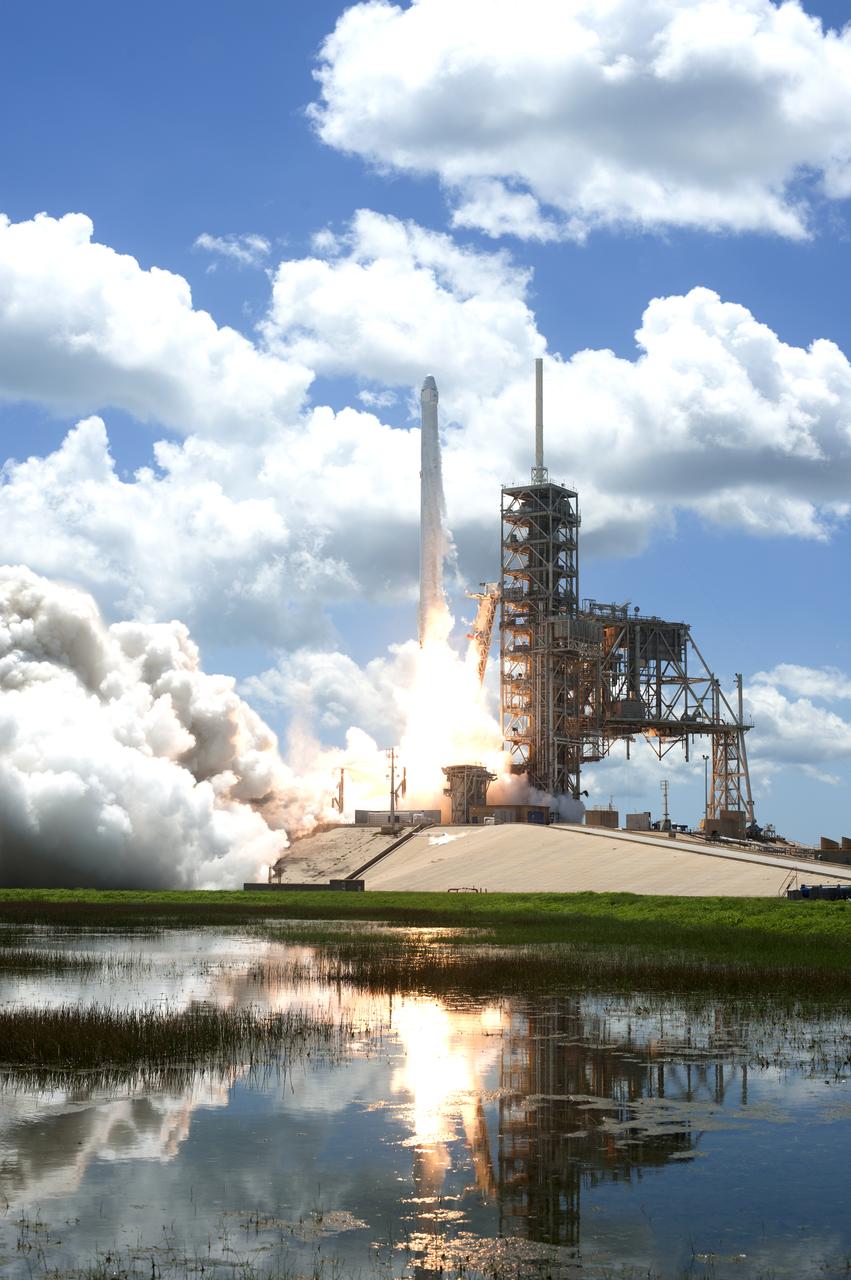 The two-stage SpaceX Falcon 9 launch vehicle lifts off Launch Complex 39A at NASA's Kennedy Space Center carrying the Dragon resupply spacecraft to the International Space Station. Liftoff was at 12:31 p.m. EDT. On its 12th commercial resupply services mission to the International Space Station, Dragon will bring up more than 6,400 pounds of supplies and new science experiments and equipment for technology research.