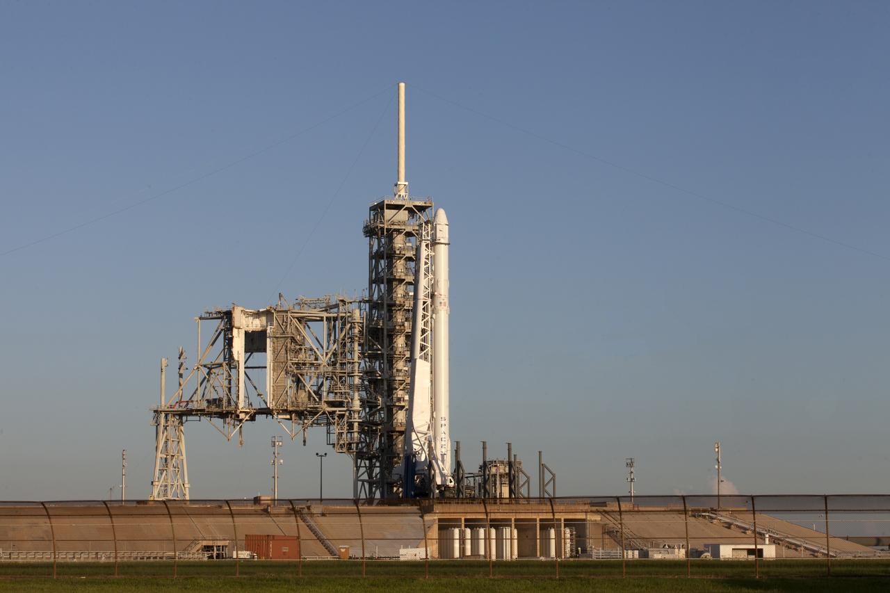 As a Falcon 9 rocket stands ready for liftoff at the Kennedy Space Center's Launch Complex 39A. The rocket will boost a Dragon resupply spacecraft to the International Space Station. Liftoff is scheduled for 12:31 p.m. EDT. On its 12th commercial resupply services mission to the space station, Dragon will bring up more than 6,400 pounds of supplies. The historic launch site now is operated by SpaceX under a property agreement signed with NASA.
