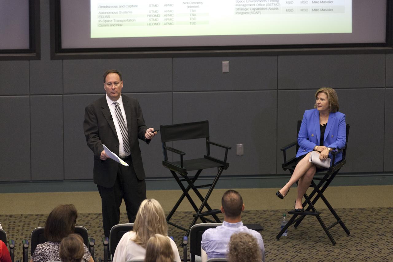 At NASA's Kennedy Space Center in Florida, agency Acting Administrator Robert Lightfoot speaks to employees during a town hall meeting in the conference room of Operations Support Building II. To the right is Deputy Associate Administrator Lesa Roe. During the gathering, they updated progress on NASA programs.