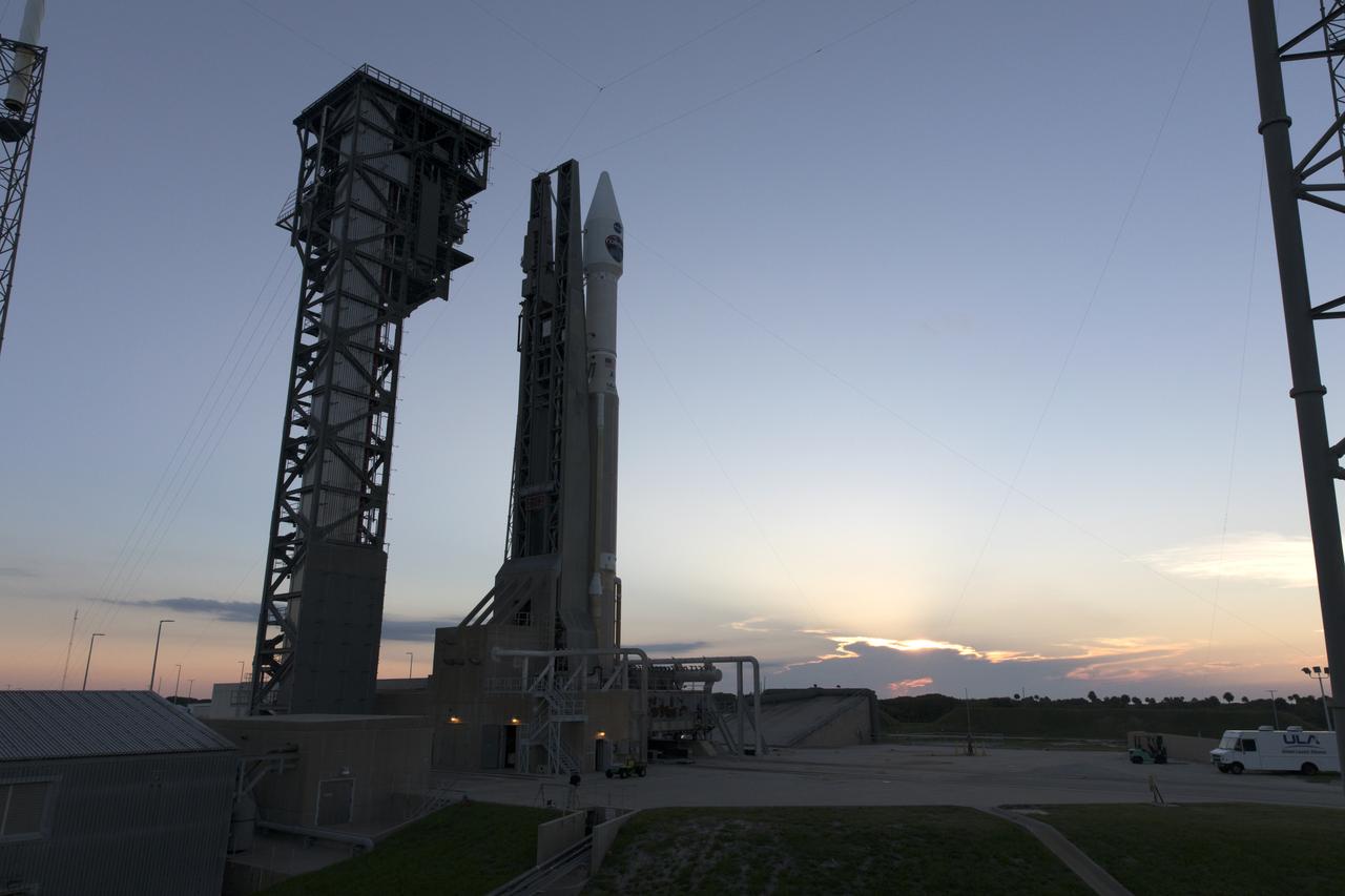 A United Launch Alliance Atlas V rocket reflects the rising sun as it stands at Space Launch Complex 41 at Cape Canaveral Air Force Station in Florida. The launch vehicle will send NASA's Tracking and Data Relay Satellite, TDRS-M to orbit. TDRS-M is the latest spacecraft destined for the agency's constellation of communications satellites that allows nearly continuous contact with orbiting spacecraft ranging from the International Space Station and Hubble Space Telescope to the array of scientific observatories. Liftoff atop a United Launch Alliance Atlas V rocket is scheduled to take place from Space Launch Complex 41 at Cape Canaveral Air Force Station at 8:03 a.m. EDT Aug. 18.