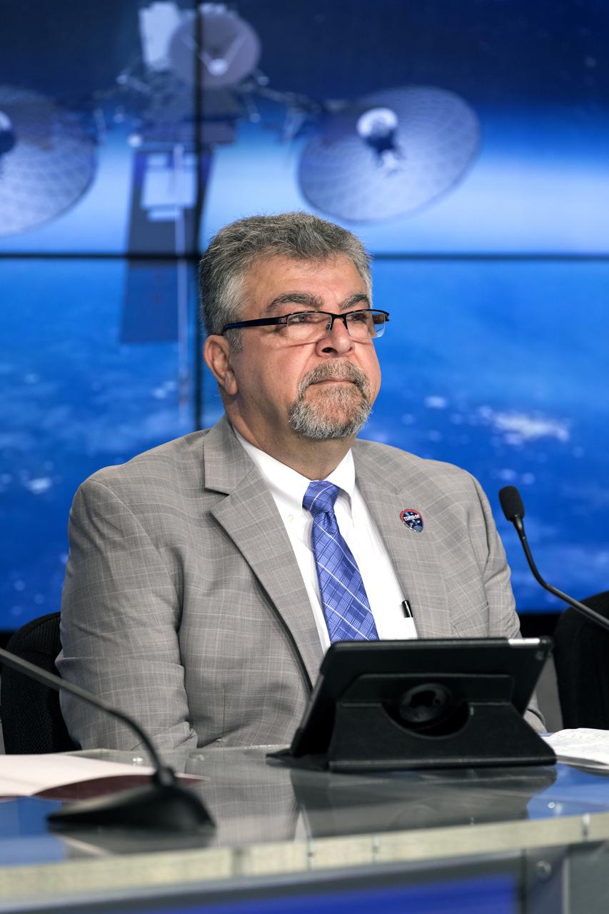In the Kennedy Space Center's Press Site auditorium, Badri Younes, deputy associate administrator for Space Communications and Navigation at NASA Headquarters in Washington, speaks to members of the media at a prelaunch news conference for NASA's Tracking and Data Relay Satellite, TDRS-M. It is the latest spacecraft destined for the agency's constellation of communications satellites that allows nearly continuous contact with orbiting spacecraft ranging from the International Space Station and Hubble Space Telescope to the array of scientific observatories. Liftoff atop a United Launch Alliance Atlas V rocket is scheduled to take place from Space Launch Complex 41 at Cape Canaveral Air Force Station at 8:03 a.m. EDT Aug. 18.