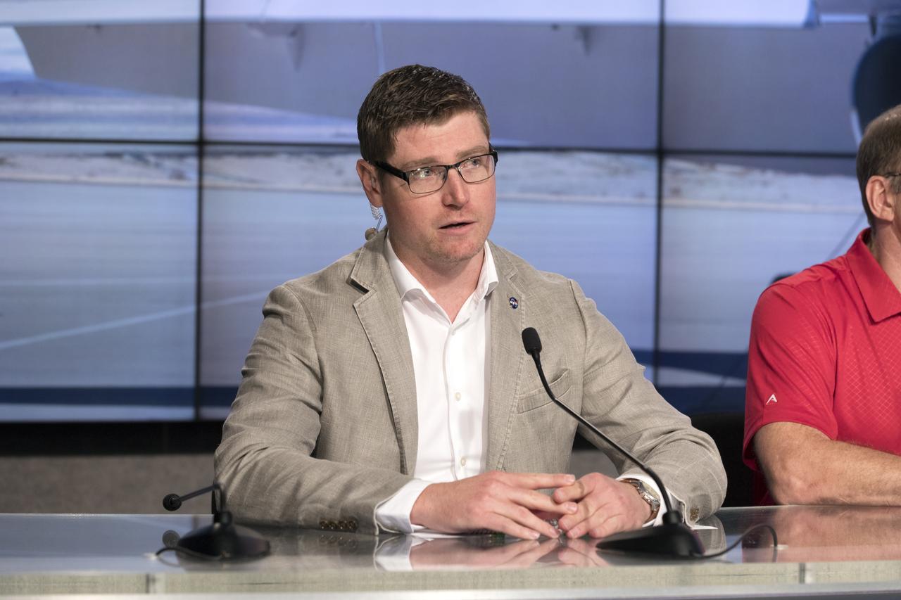 In the Kennedy Space Center's Press Site auditorium, Matthew Kamlet of NASA Communications at the Armstrong Flight Research Center in California, speaks to members of the media at a news conference to discuss upcoming flight tests to study the effects of sonic booms. Kennedy is partnering with Armstrong, Langley and Space Florida for a program called SonicBAT for Sonic Booms in Atmospheric Turbulence. Starting in August, NASA F-18 jets will take off from the Shuttle Landing Facility and fly at supersonic speeds while agency researchers on the ground measure the effects of low-altitude turbulence on sonic booms. The study could lead to technology mitigating the annoying sonic booms making possible supersonic flights over populated areas.