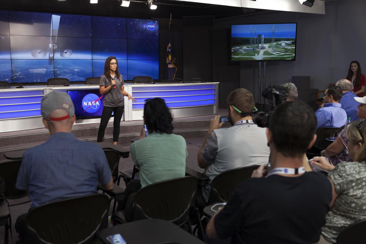 Emily Furfaro of the NASA Social Media Team speaks to members of social media in the Kennedy Space Center’s Press Site auditorium. The briefing focused on preparations to launch NASA's Tracking and Data Relay Satellite, TDRS-M. The latest spacecraft destined for the agency's constellation of communications satellites, TDRS-M will allow nearly continuous contact with orbiting spacecraft ranging from the International Space Station and Hubble Space Telescope to the array of scientific observatories. Liftoff atop a United Launch Alliance Atlas V rocket is scheduled to take place from Space Launch Complex 41 at Cape Canaveral Air Force Station at 8:03 a.m. EDT Aug. 18.