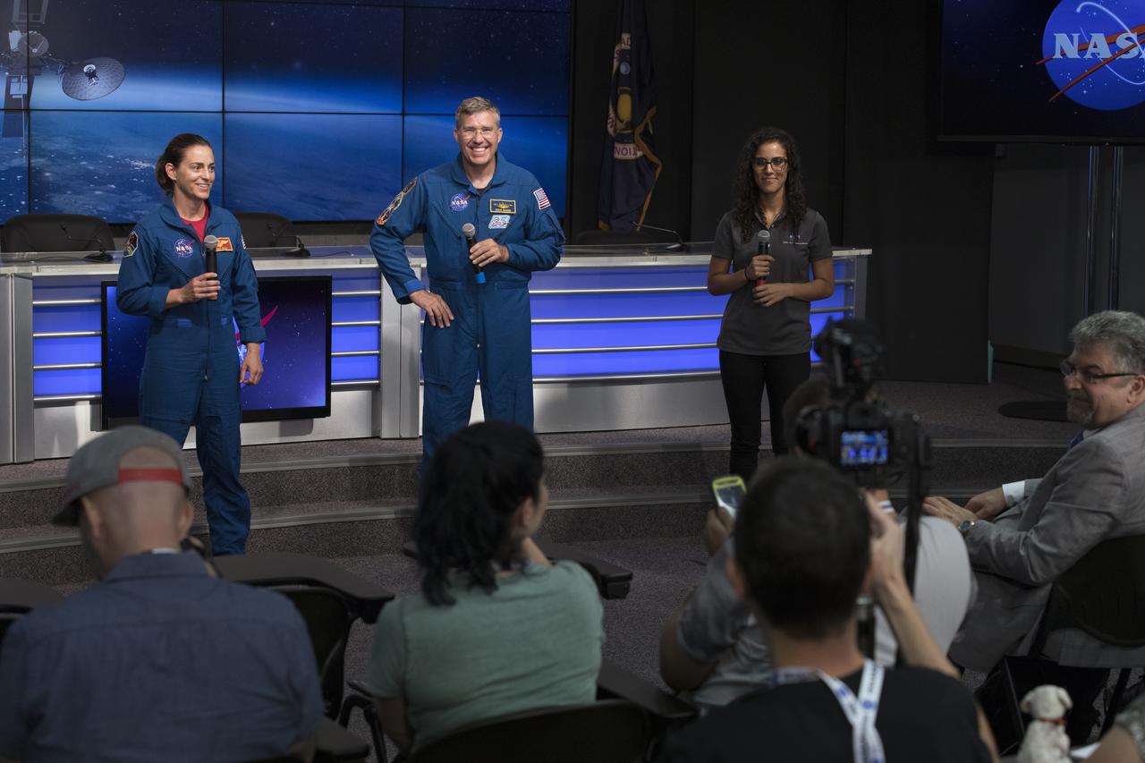 NASA astronauts Nicole Mann, left, and Steve Bowen speak to members of social media in the Kennedy Space Center’s Press Site auditorium. With them on the right is Emily Furfaro of the NASA Social Media Team. The briefing focused on preparations to launch NASA's Tracking and Data Relay Satellite, TDRS-M. The latest spacecraft destined for the agency's constellation of communications satellites, TDRS-M will allow nearly continuous contact with orbiting spacecraft ranging from the International Space Station and Hubble Space Telescope to the array of scientific observatories. Liftoff atop a United Launch Alliance Atlas V rocket is scheduled to take place from Space Launch Complex 41 at Cape Canaveral Air Force Station at 8:03 a.m. EDT Aug. 18.