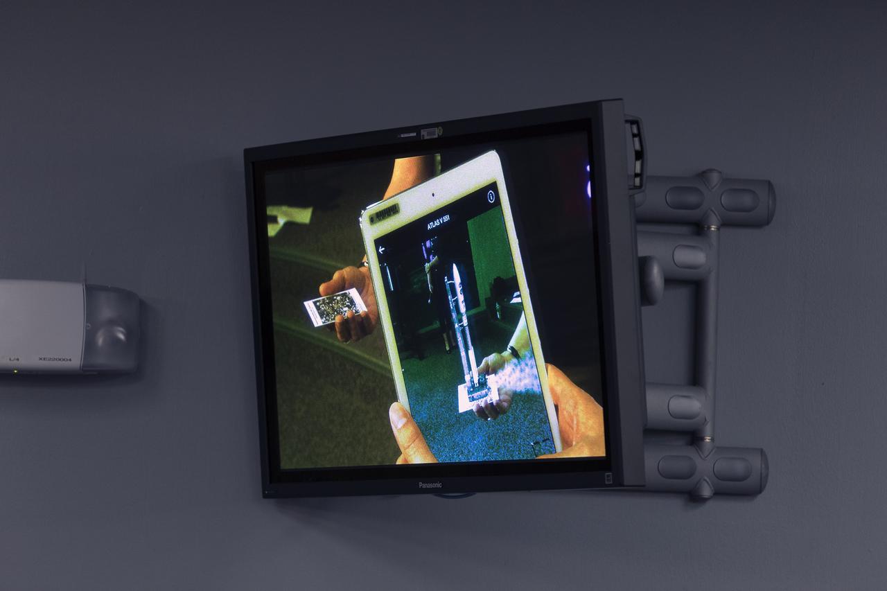 An app is demonstrated that can run on a mobile device such as a smartphone or tablet computer. The app is depicting the launch of the TDRS-M satellite on an Atlas V rocket. The demonstration took place during a briefing focused on preparations to launch NASA's Tracking and Data Relay Satellite, TDRS-M. The latest spacecraft destined for the agency's constellation of communications satellites, TDRS-M will allow nearly continuous contact with orbiting spacecraft ranging from the International Space Station and Hubble Space Telescope to the array of scientific observatories. Liftoff atop a United Launch Alliance Atlas V rocket is scheduled to take place from Space Launch Complex 41 at Cape Canaveral Air Force Station at 8:03 a.m. EDT Aug. 18.