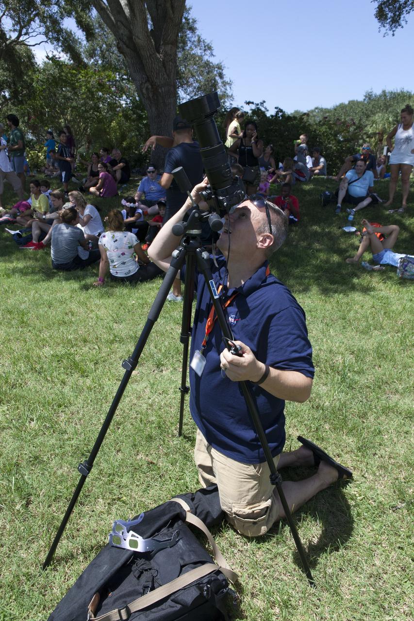 From the Kennedy Space Center Visitor Complex, guests joined Americans from coast to coast following the solar eclipse. Although a partial eclipse on Florida's Space Coast, young and old alike found many ways to watch the rare astronomical event. As the Moon passed between Earth and the midafternoon Sun, a shadow moved across the landscape. The 70-mile-wide totality path, or "umbral cone" -- where the entire Sun will vanish behind the Moon -- stretched across 14 states, from Oregon to South Carolina.