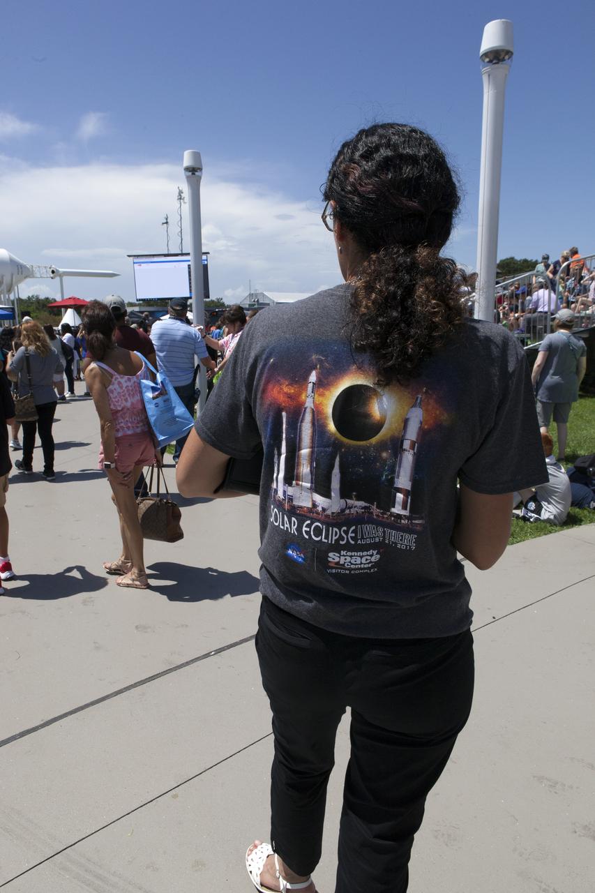 From the Kennedy Space Center Visitor Complex, guests joined Americans from coast to coast following the solar eclipse. Although a partial eclipse on Florida's Space Coast, young and old alike found many ways to watch the rare astronomical event. As the Moon passed between Earth and the midafternoon Sun, a shadow moved across the landscape. The 70-mile-wide totality path, or "umbral cone" -- where the entire Sun will vanish behind the Moon -- stretched across 14 states, from Oregon to South Carolina.