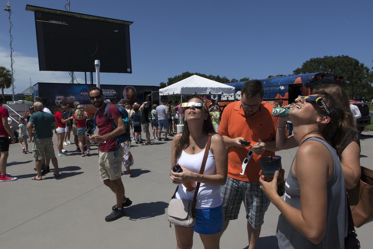 From the Kennedy Space Center Visitor Complex, guests joined Americans from coast to coast following the solar eclipse. Although a partial eclipse on Florida's Space Coast, young and old alike found many ways to watch the rare astronomical event. As the Moon passed between Earth and the midafternoon Sun, a shadow moved across the landscape. The 70-mile-wide totality path, or "umbral cone" -- where the entire Sun will vanish behind the Moon -- stretched across 14 states, from Oregon to South Carolina.