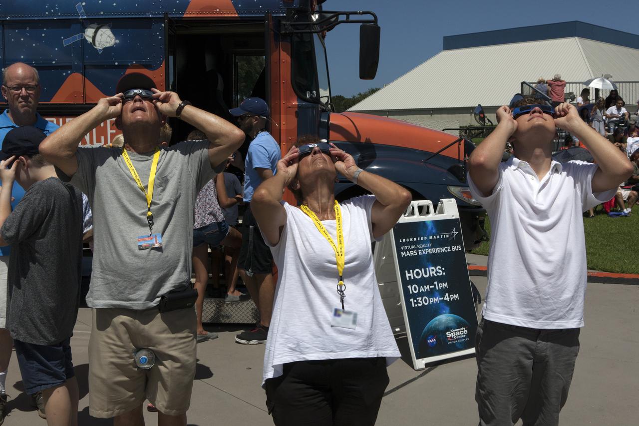 From the Kennedy Space Center Visitor Complex, guests joined Americans from coast to coast following the solar eclipse. Although a partial eclipse on Florida's Space Coast, young and old alike found many ways to watch the rare astronomical event. As the Moon passed between Earth and the midafternoon Sun, a shadow moved across the landscape. The 70-mile-wide totality path, or "umbral cone" -- where the entire Sun will vanish behind the Moon -- stretched across 14 states, from Oregon to South Carolina.
