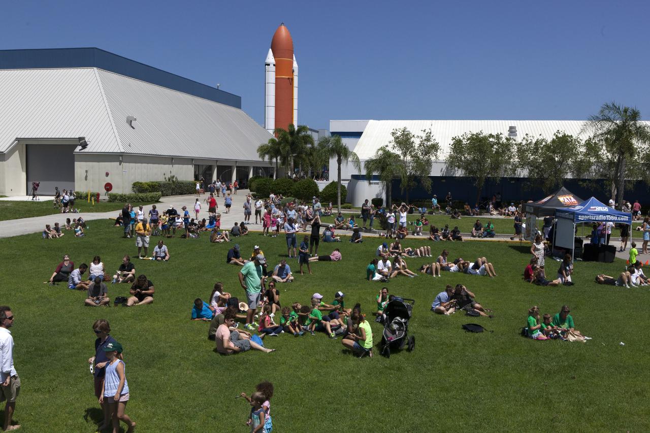 From the Kennedy Space Center Visitor Complex, guests joined Americans from coast to coast following the solar eclipse. Although a partial eclipse on Florida's Space Coast, young and old alike found many ways to watch the rare astronomical event. As the Moon passed between Earth and the midafternoon Sun, a shadow moved across the landscape. The 70-mile-wide totality path, or "umbral cone" -- where the entire Sun will vanish behind the Moon -- stretched across 14 states, from Oregon to South Carolina.