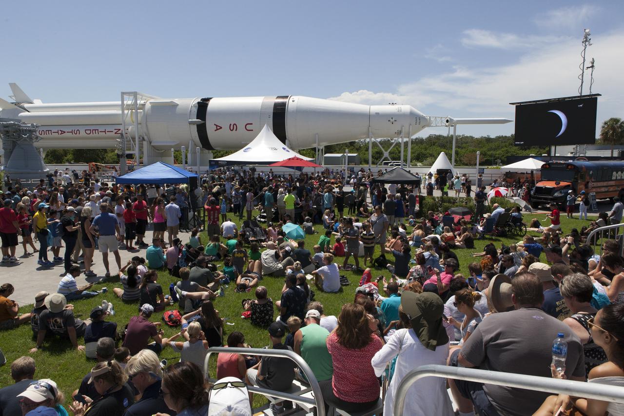 From the Kennedy Space Center Visitor Complex, guests joined Americans from coast to coast following the solar eclipse. Although a partial eclipse on Florida's Space Coast, young and old alike found many ways to watch the rare astronomical event. As the Moon passed between Earth and the midafternoon Sun, a shadow moved across the landscape. The 70-mile-wide totality path, or "umbral cone" -- where the entire Sun will vanish behind the Moon -- stretched across 14 states, from Oregon to South Carolina.