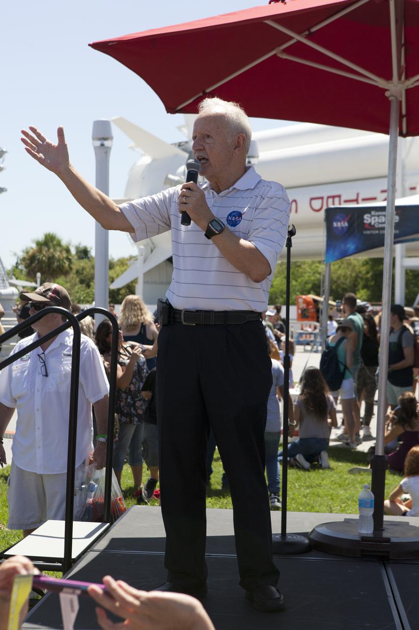 From the Kennedy Space Center Visitor Complex, guests joined Americans from coast to coast following the solar eclipse. Speaking at the event was astronaut John-David Bartoe. Although a partial eclipse on Florida's Space Coast, young and old alike found many ways to watch the rare astronomical event. As the Moon passed between Earth and the midafternoon Sun, a shadow moved across the landscape. The 70-mile-wide totality path, or "umbral cone" -- where the entire Sun will vanish behind the Moon -- stretched across 14 states, from Oregon to South Carolina.