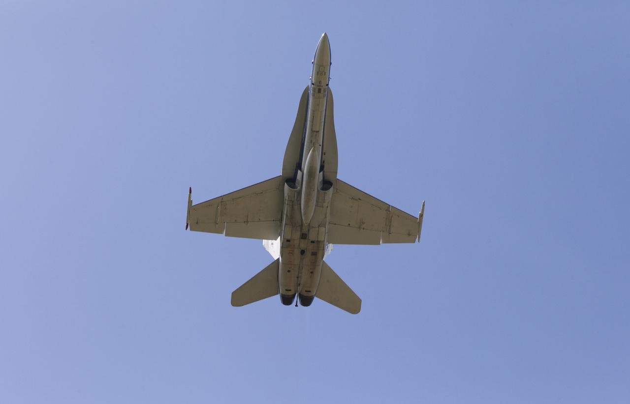 A NASA F-18 jet takes off from the agency's Shuttle Landing Facility at NASA's Kennedy Space Center in Florida. Several flights a day have been taking place the week of Aug. 21, 2017 to measure the effects of sonic booms. It is part of NASA's Sonic Booms in Atmospheric Turbulence, or SonicBAT II Program. NASA at Kennedy is partnering with the agency's Armstrong Flight Research Center in California, Langley Research Center in Virginia, and Space Florida for a program in which F-18 jets will take off from the Shuttle Landing Facility and fly at supersonic speeds while agency researchers measure the effects of low-altitude turbulence caused by sonic booms.
