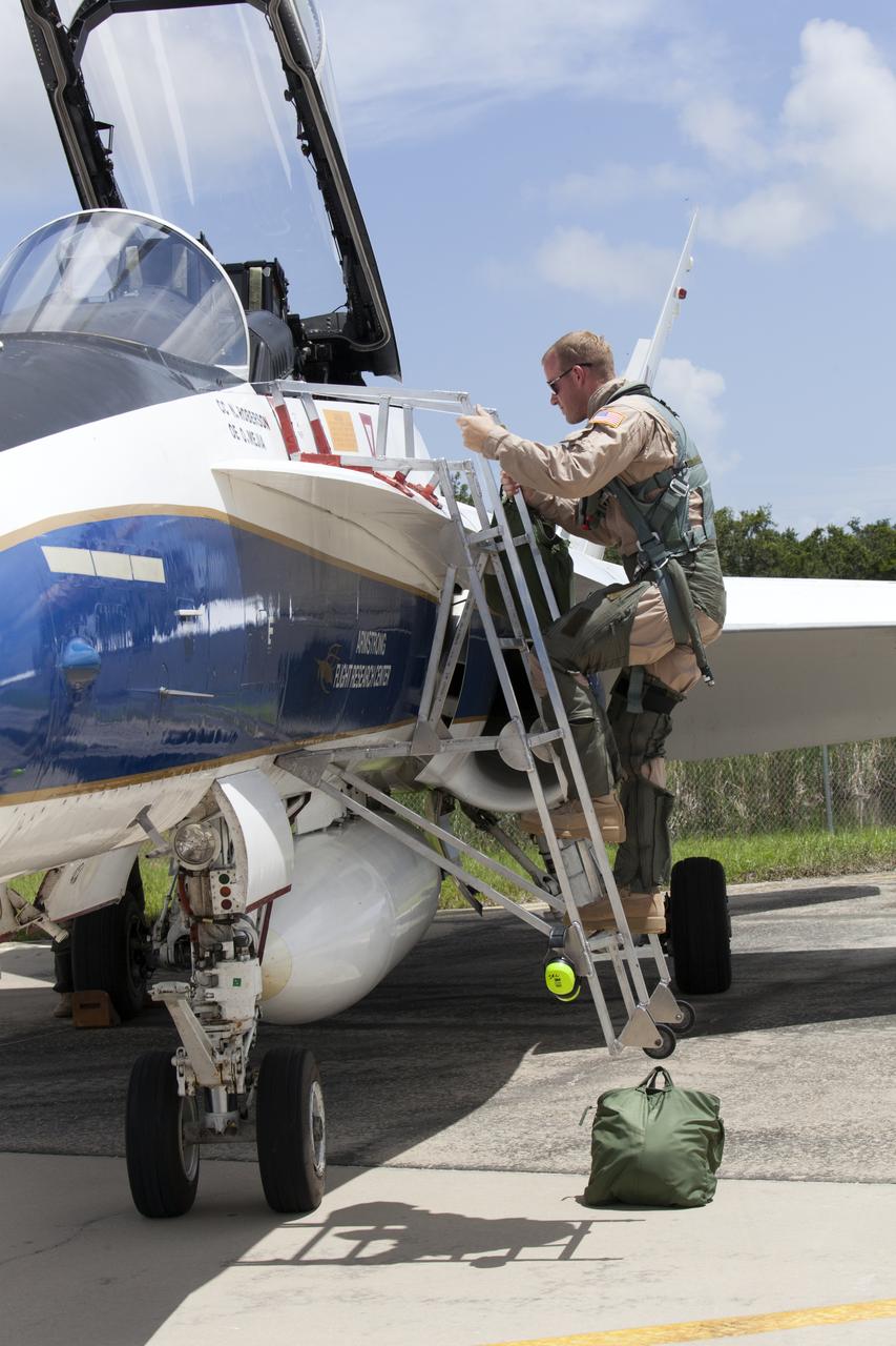 A NASA pilot boards an F-18 jet prior to take off from the agency's Shuttle Landing Facility at NASA's Kennedy Space Center in Florida. Several flights a day have been taking place the week of Aug. 21, 2017 to measure the effects of sonic booms. It is part of NASA's Sonic Booms in Atmospheric Turbulence, or SonicBAT II Program. NASA at Kennedy is partnering with the agency's Armstrong Flight Research Center in California, Langley Research Center in Virginia, and Space Florida for a program in which F-18 jets will take off from the Shuttle Landing Facility and fly at supersonic speeds while agency researchers measure the effects of low-altitude turbulence caused by sonic booms.