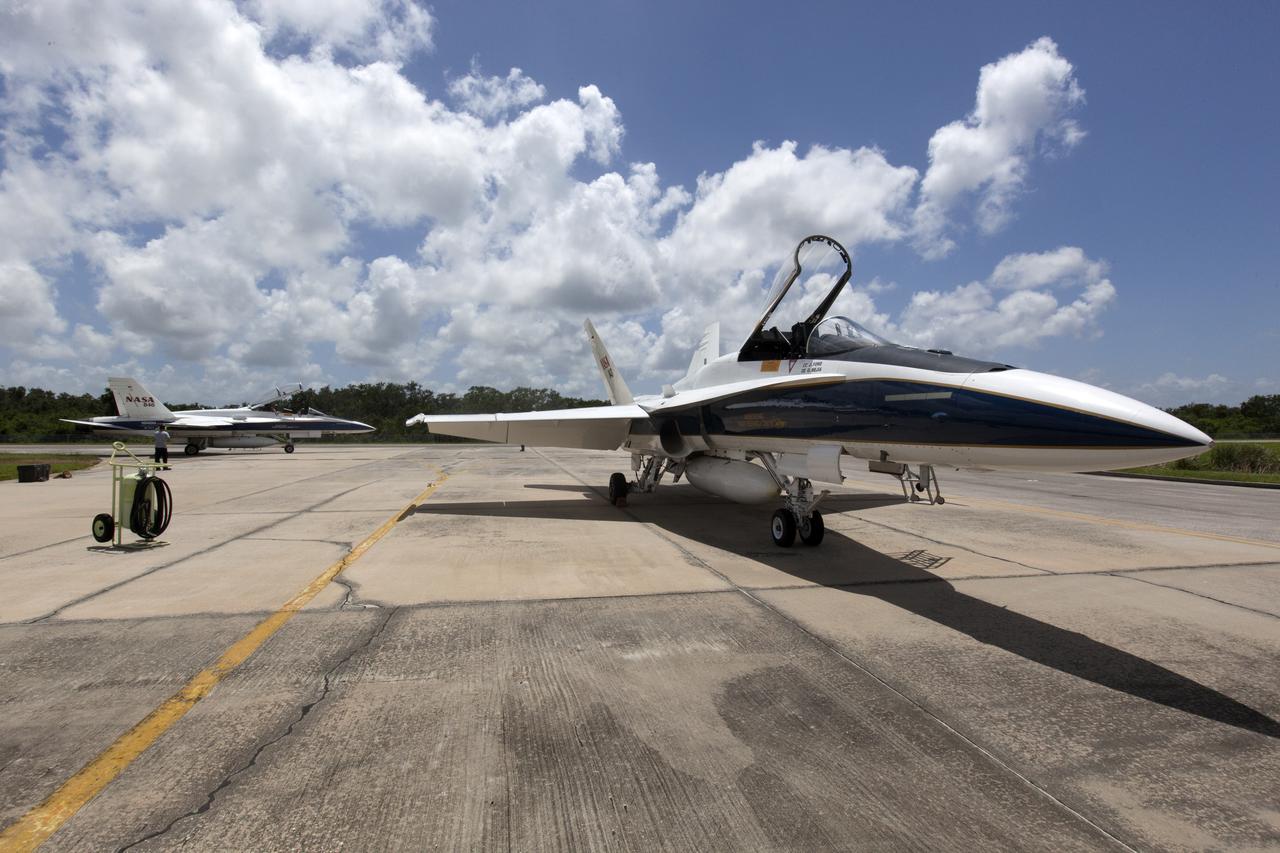 A NASA F-18 jet is prepared for takeoff from the agency's Shuttle Landing Facility at NASA's Kennedy Space Center in Florida. Several flights a day have been taking place the week of Aug. 21, 2017 to measure the effects of sonic booms. It is part of NASA's Sonic Booms in Atmospheric Turbulence, or SonicBAT II Program. NASA at Kennedy is partnering with the agency's Armstrong Flight Research Center in California, Langley Research Center in Virginia, and Space Florida for a program in which F-18 jets will take off from the Shuttle Landing Facility and fly at supersonic speeds while agency researchers measure the effects of low-altitude turbulence caused by sonic booms.