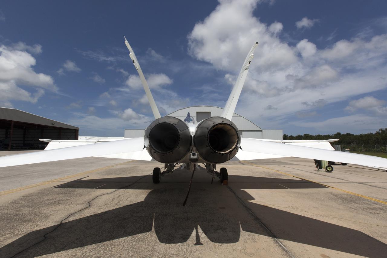 A NASA F-18 jet is prepared for takeoff from the agency's Shuttle Landing Facility at NASA's Kennedy Space Center in Florida. Several flights a day have been taking place the week of Aug. 21, 2017 to measure the effects of sonic booms. It is part of NASA's Sonic Booms in Atmospheric Turbulence, or SonicBAT II Program. NASA at Kennedy is partnering with the agency's Armstrong Flight Research Center in California, Langley Research Center in Virginia, and Space Florida for a program in which F-18 jets will take off from the Shuttle Landing Facility and fly at supersonic speeds while agency researchers measure the effects of low-altitude turbulence caused by sonic booms.