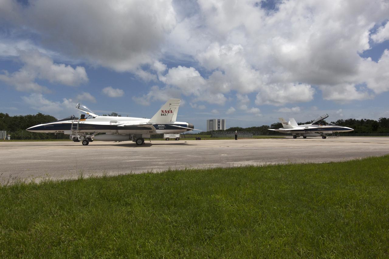 NASA F-18 jets prepare for takeoff from the agency's Shuttle Landing Facility at NASA's Kennedy Space Center in Florida. Several flights a day have been taking place the week of Aug. 21, 2017 to measure the effects of sonic booms. It is part of NASA's Sonic Booms in Atmospheric Turbulence, or SonicBAT II Program. NASA at Kennedy is partnering with the agency's Armstrong Flight Research Center in California, Langley Research Center in Virginia, and Space Florida for a program in which F-18 jets will take off from the Shuttle Landing Facility and fly at supersonic speeds while agency researchers measure the effects of low-altitude turbulence caused by sonic booms.