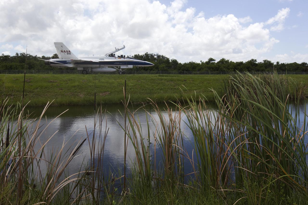 A NASA F-18 jet is prepared for takeoff from the agency's Shuttle Landing Facility at NASA's Kennedy Space Center in Florida. Several flights a day have been taking place the week of Aug. 21, 2017 to measure the effects of sonic booms. It is part of NASA's Sonic Booms in Atmospheric Turbulence, or SonicBAT II Program. NASA at Kennedy is partnering with the agency's Armstrong Flight Research Center in California, Langley Research Center in Virginia, and Space Florida for a program in which F-18 jets will take off from the Shuttle Landing Facility and fly at supersonic speeds while agency researchers measure the effects of low-altitude turbulence caused by sonic booms.
