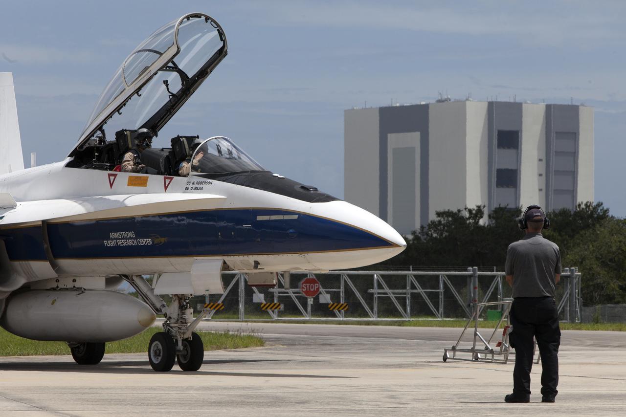 A NASA F-18 jet is prepared for takeoff from the agency's Shuttle Landing Facility at NASA's Kennedy Space Center in Florida. Several flights a day have been taking place the week of Aug. 21, 2017 to measure the effects of sonic booms. It is part of NASA's Sonic Booms in Atmospheric Turbulence, or SonicBAT II Program. NASA at Kennedy is partnering with the agency's Armstrong Flight Research Center in California, Langley Research Center in Virginia, and Space Florida for a program in which F-18 jets will take off from the Shuttle Landing Facility and fly at supersonic speeds while agency researchers measure the effects of low-altitude turbulence caused by sonic booms.