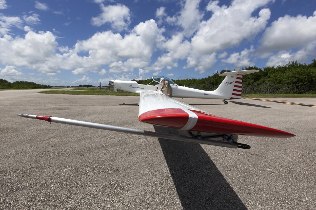 A motorized glider prepares to take off from the Shuttle Landing Facility at NASA's Kennedy Space Center in Florida. Flying with its engine off, the glider will be positioned above the 14,000-foot level to measure sonic booms created by agency F-18 jets to measure the effects of sonic booms. Several flights a day have been taking place the week of Aug. 21, 2017 as part of NASA's Sonic Booms in Atmospheric Turbulence, or SonicBAT II Program. NASA at Kennedy is partnering with the agency's Armstrong Flight Research Center in California, Langley Research Center in Virginia, and Space Florida for a program in which F-18 jets will take off from the Shuttle Landing Facility and fly at supersonic speeds while agency researchers measure the effects of low-altitude turbulence caused by sonic booms.