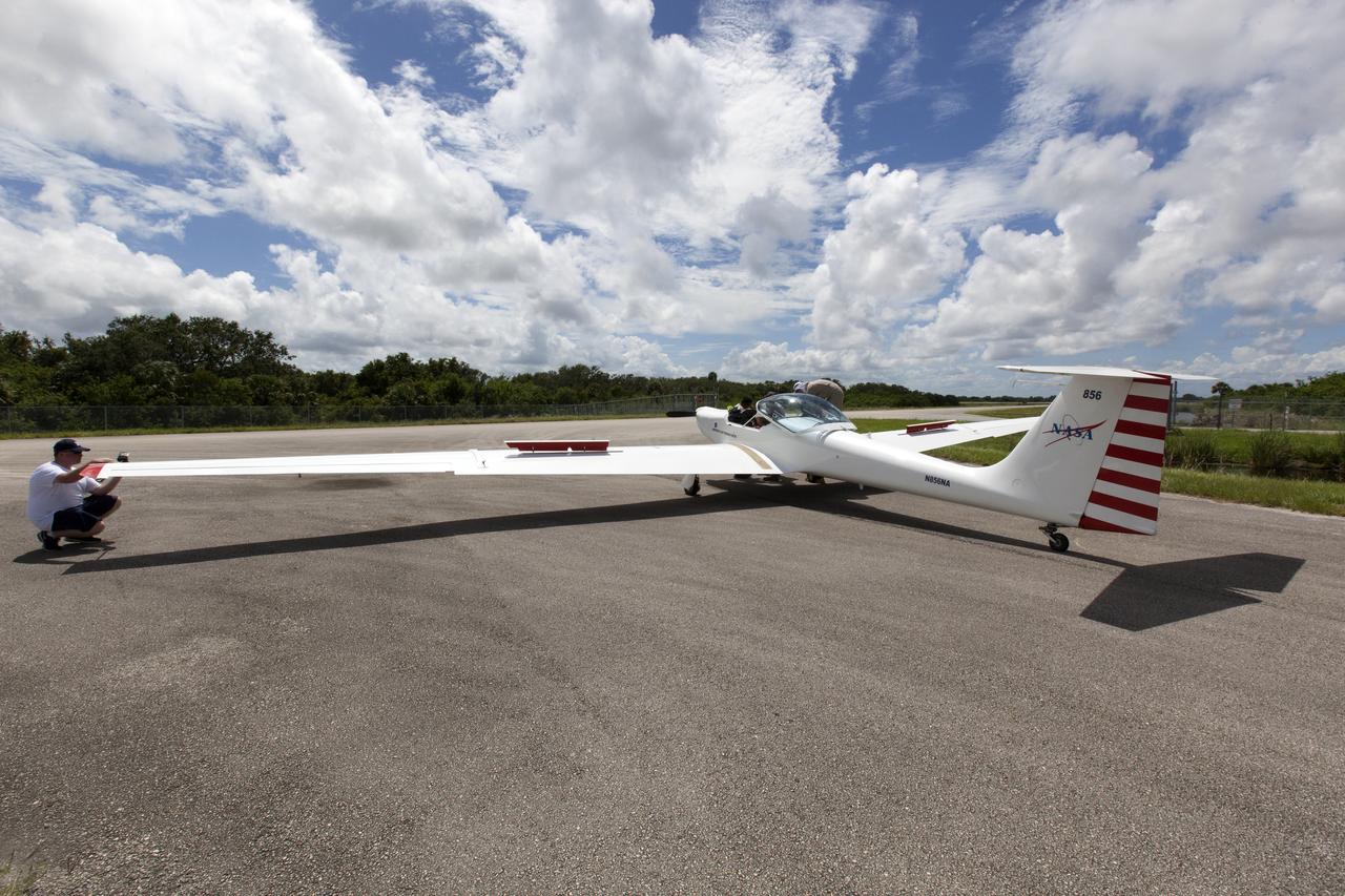 A motorized glider prepares to take off from the Shuttle Landing Facility at NASA's Kennedy Space Center in Florida. Flying with its engine off, the glider will be positioned above the 14,000-foot level to measure sonic booms created by agency F-18 jets to measure the effects of sonic booms. Several flights a day have been taking place the week of Aug. 21, 2017 as part of NASA's Sonic Booms in Atmospheric Turbulence, or SonicBAT II Program. NASA at Kennedy is partnering with the agency's Armstrong Flight Research Center in California, Langley Research Center in Virginia, and Space Florida for a program in which F-18 jets will take off from the Shuttle Landing Facility and fly at supersonic speeds while agency researchers measure the effects of low-altitude turbulence caused by sonic booms.