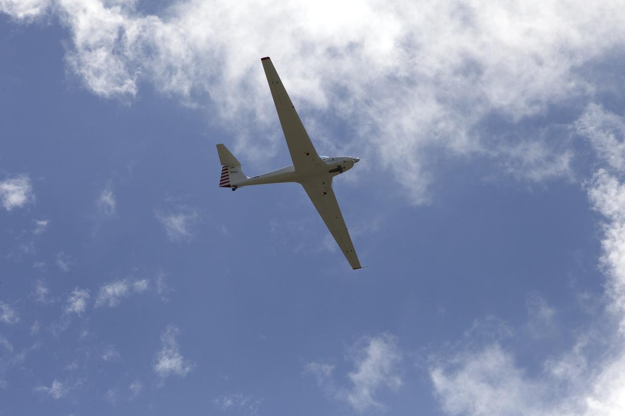 A motorized glider has taken off from the Shuttle Landing Facility at NASA's Kennedy Space Center in Florida. Flying with its engine off, the glider will be positioned above the 14,000-foot level to measure sonic booms created by agency F-18 jets to measure the effects of sonic booms. Several flights a day have been taking place the week of Aug. 21, 2017 as part of NASA's Sonic Booms in Atmospheric Turbulence, or SonicBAT II Program. NASA at Kennedy is partnering with the agency's Armstrong Flight Research Center in California, Langley Research Center in Virginia, and Space Florida for a program in which F-18 jets will take off from the Shuttle Landing Facility and fly at supersonic speeds while agency researchers measure the effects of low-altitude turbulence caused by sonic booms.