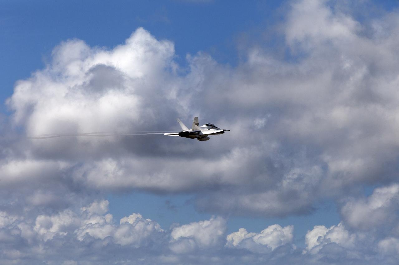 A NASA F-18 jet has taken off from the agency's Shuttle Landing Facility at NASA's Kennedy Space Center in Florida. Several flights a day have been taking place the week of Aug. 21, 2017 to measure the effects of sonic booms. It is part of NASA's Sonic Booms in Atmospheric Turbulence, or SonicBAT II Program. NASA at Kennedy is partnering with the agency's Armstrong Flight Research Center in California, Langley Research Center in Virginia, and Space Florida for a program in which F-18 jets will take off from the Shuttle Landing Facility and fly at supersonic speeds while agency researchers measure the effects of low-altitude turbulence caused by sonic booms.