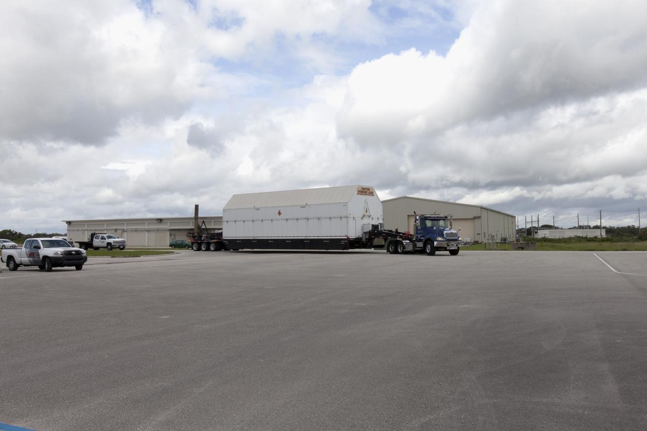 A United Launch Alliance Delta IV Heavy second stage, packaged in its shipping container, arrives at the Horizontal Integration Facility at Cape Canaveral Air Force Station for preflight processing. The Delta IV Heavy will launch NASA's upcoming Parker Solar Probe mission. The mission will perform the closest-ever observations of a star when it travels through the Sun's atmosphere, called the corona. The probe will rely on measurements and imaging to revolutionize our understanding of the corona and the Sun-Earth connection. Liftoff atop the Delta IV Heavy rocket is scheduled to take place from Cape Canaveral's Space Launch Complex 37 in summer 2018.
