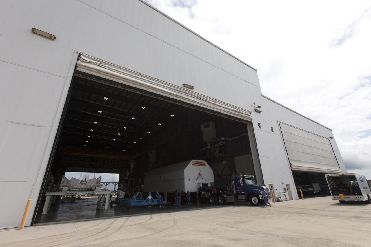 A United Launch Alliance Delta IV Heavy second stage, packaged in its shipping container, arrives at the Horizontal Integration Facility at Cape Canaveral Air Force Station for preflight processing. The Delta IV Heavy will launch NASA's upcoming Parker Solar Probe mission. The mission will perform the closest-ever observations of a star when it travels through the Sun's atmosphere, called the corona. The probe will rely on measurements and imaging to revolutionize our understanding of the corona and the Sun-Earth connection. Liftoff atop the Delta IV Heavy rocket is scheduled to take place from Cape Canaveral's Space Launch Complex 37 in summer 2018.