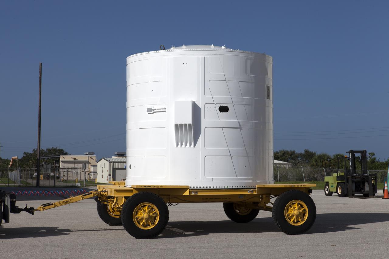 The Exploration Mission-1 (EM-1) left-hand forward skirt for NASA's Space Launch System (SLS) solid rocket boosters is prepared for its move from Hangar AE at Cape Canaveral Air Force Station in Florida, to the Booster Fabrication Facility (BFF) at Kennedy Space Center. In the BFF, the forward skirt will be inspected and prepared for use on the left-hand solid rocket booster for EM-1. NASA's Orion spacecraft will fly atop the SLS rocket on its first uncrewed flight test.