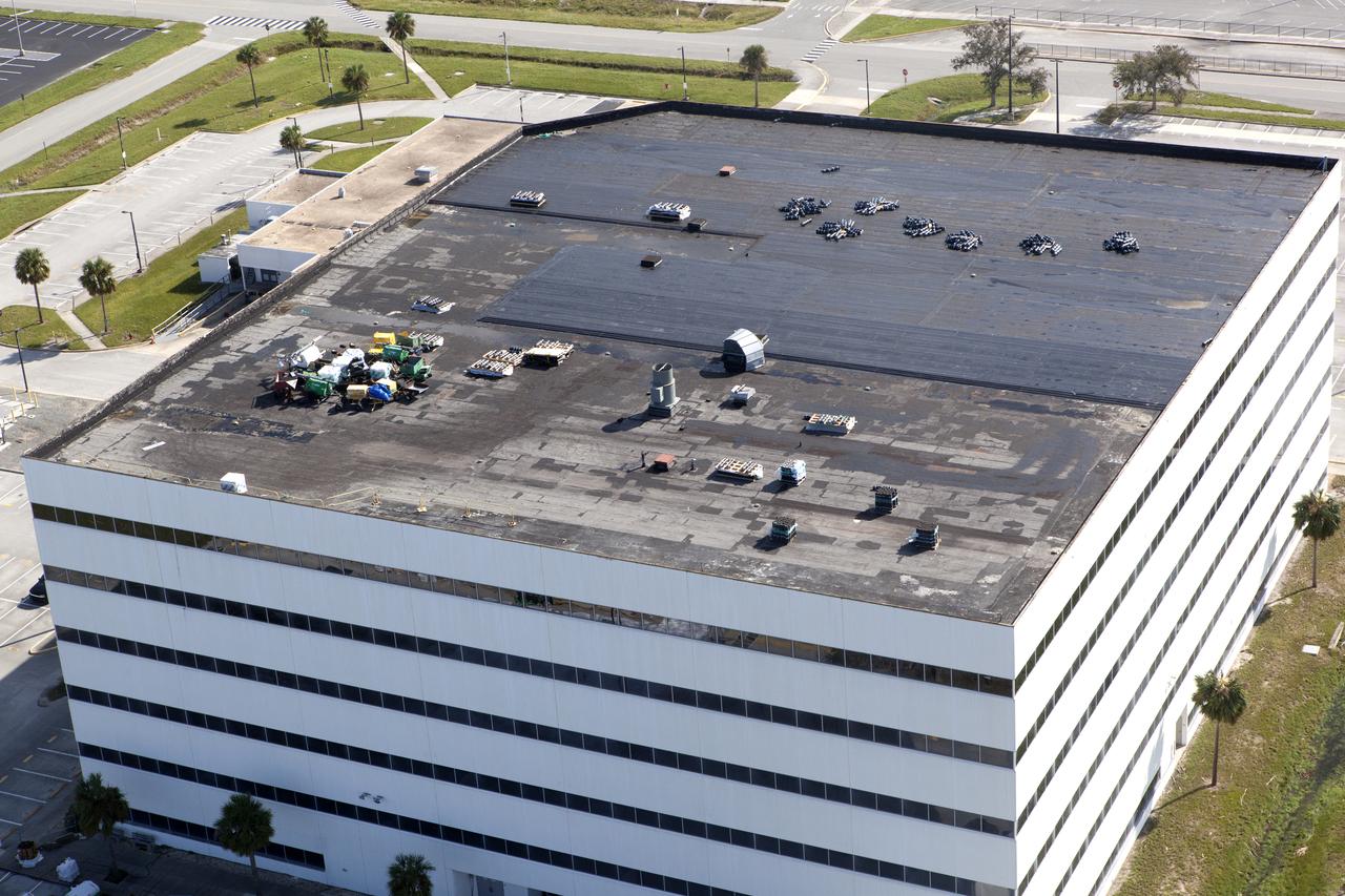 The Operations Support Building I (OSB I) is seen during an aerial survey of NASA's Kennedy Space Center in Florida on September 12, 2017. The roof of the building is currently undergoing repair from Hurricane Matthew. The survey was performed to identify structures and facilities that may have sustained damage from Hurricane Irma as the storm passed Kennedy on September 10, 2017. NASA closed the center ahead of the storm's onset and only a small team of specialists known as the Rideout Team was on the center as the storm approached and passed.