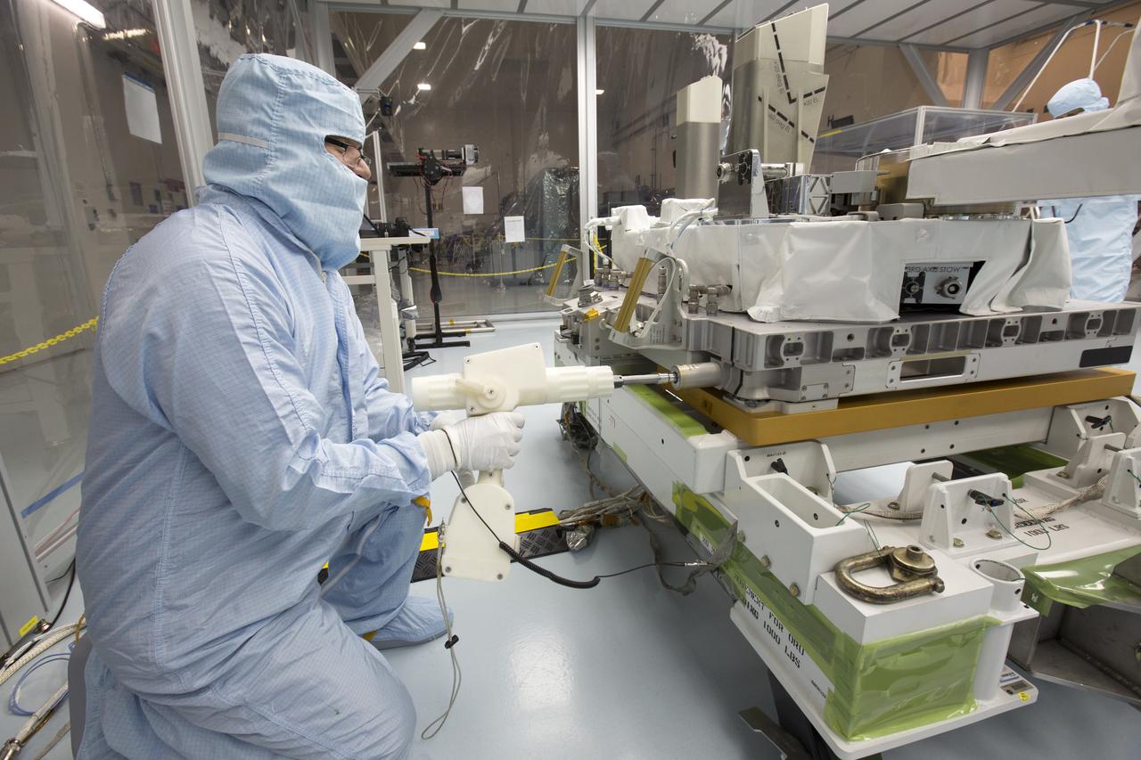 In the high bay of Kennedy Space Center's Space Station Processing Facility, Chris Hardcastle of Stinger-Ghaffarian Technologies performs spacewalk tool fit-checks of the integrated Total and Spectral Solar Irradiance Sensor-1 (TSIS-1) payload and the EXPRESS Pallet Adapter. TSIS-1 is designed to measure the Sun's energy input into Earth by seeing how it is distributed across different wavelengths of light. These measurements help scientists establish Earth's total energy and how our planet's atmosphere responds to changes in the Sun's energy output. TSIS-1 will launch on SpaceX's 13th commercial resupply mission to the International Space Station.