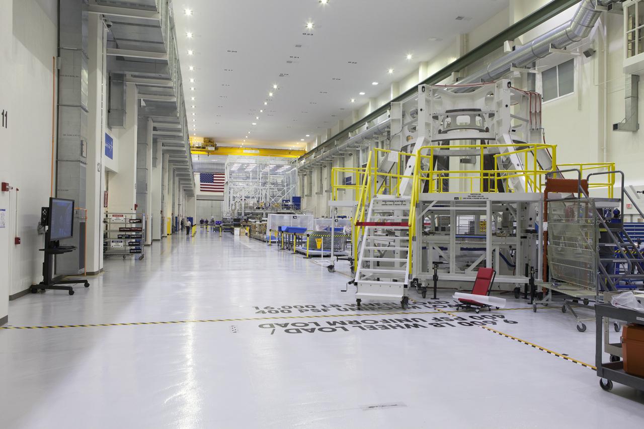 A few of the work stations and work stands are in view inside the high bay in the Neil Armstrong Operations and Checkout Building at NASA's Kennedy Space Center in Florida. The Orion crew module pressure vessel is undergoing processing to prepare it for its first uncrewed integrated flight atop the Space Launch System rocket on Exploration Mission-1.
