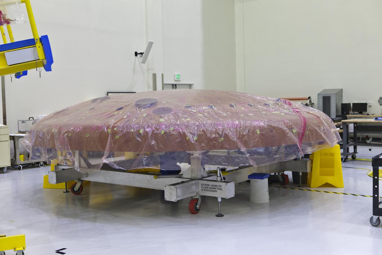 The Orion heat shield is undergoing processing in the Neil Armstrong Operations and Checkout Building high bay at NASA's Kennedy Space Center in Florida.  Orion is being prepared for its first uncrewed integrated flight atop the Space Launch System rocket on Exploration Mission-1. 