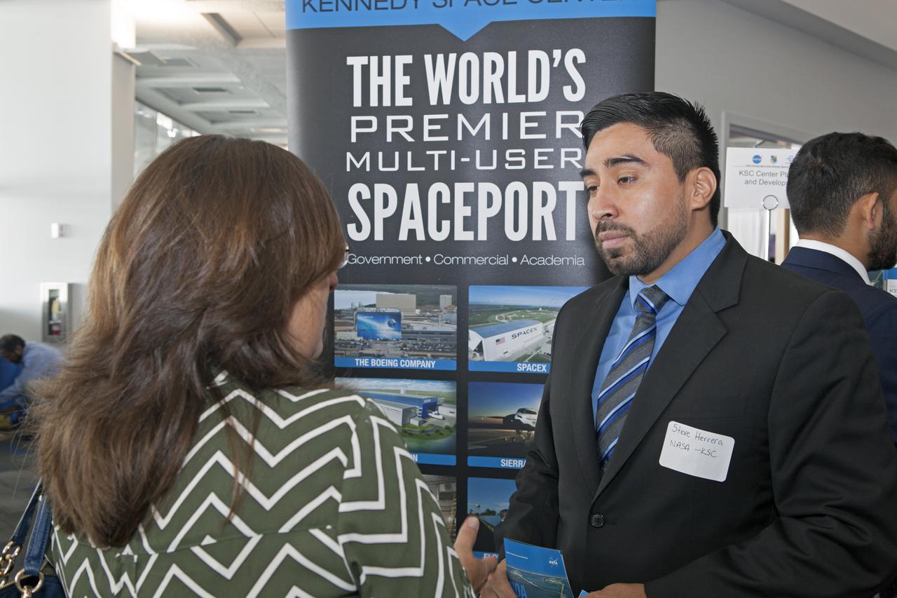 An exhibitor answers questions at Kennedy Space Center's 27th Business Opportunities Expo held at Cruise Terminal 5 at Port Canaveral in Florida. The event featured more than 180 businesses, large and small, and government exhibitors from throughout the Space Coast and the nation. The Business Opportunities Expo is sponsored by the NASA KSC Prime Contractor Board, KSC Industry Assistance Office, 45th Space Wing and Canaveral Port Authority. Exhibitors included vendors from a variety of product and service areas, such as computer technology, engineering services, communication equipment and services, and construction and safety products, to name a few. Representatives from the 45th Space Wing, KSC prime contractors, NASA and many more agencies and organizations were on hand to provide information and answer questions. 