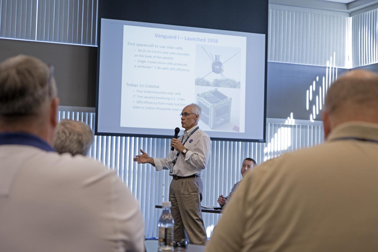 Chuck Tatro of NASA's Launch Services Program discusses the use of solar arrays on space science missions during the Energy Action Day employee event held in Kennedy Space Center's Space Station Processing Facility. Part of Energy Awareness Month, the event featured subject matter experts in the area of solar energy, its connections to the space program and options for residential solar power.