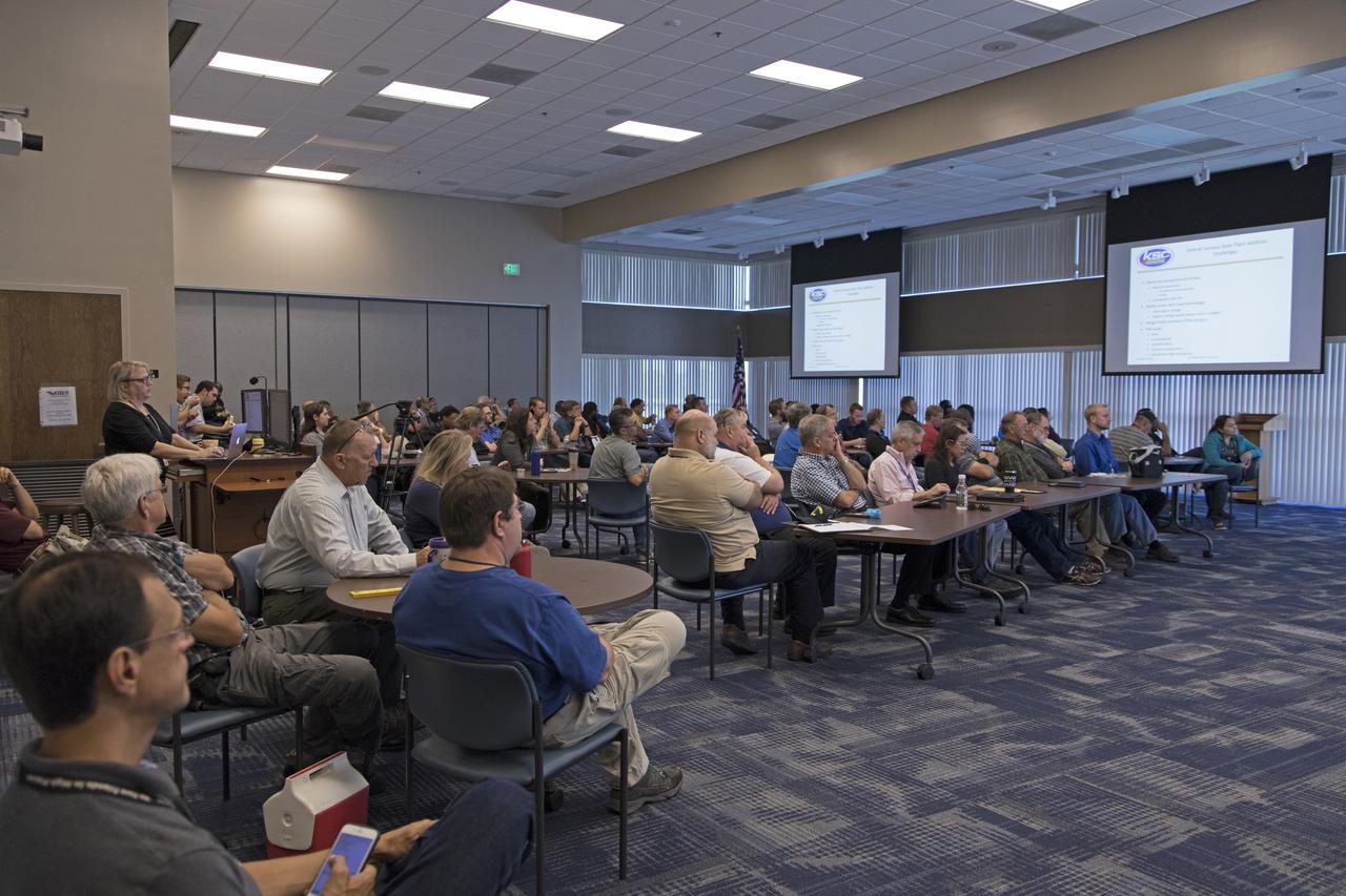 NASA Kennedy Space Center employees attend the Energy Action Day event held in the center's Space Station Processing Facility. Part of Energy Awareness Month, the event featured subject matter experts in the area of solar energy, its connections to the space program and options for residential solar power.