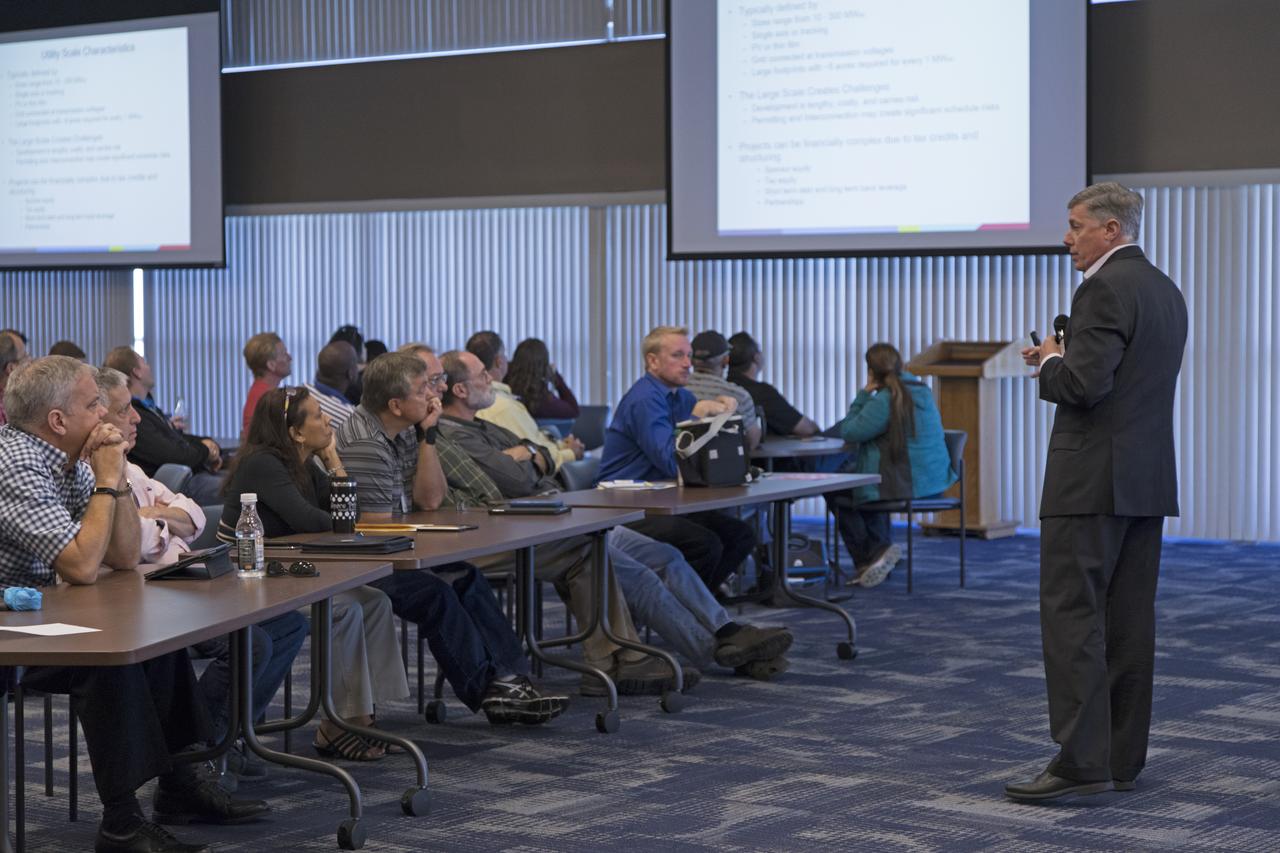 Bill McCullen of Southern Power speaks to NASA Kennedy Space Center employees during the Energy Action Day event held in Kennedy's Space Station Processing Facility. Part of Energy Awareness Month, the event featured subject matter experts in the area of solar energy, its connections to the space program and options for residential solar power. 